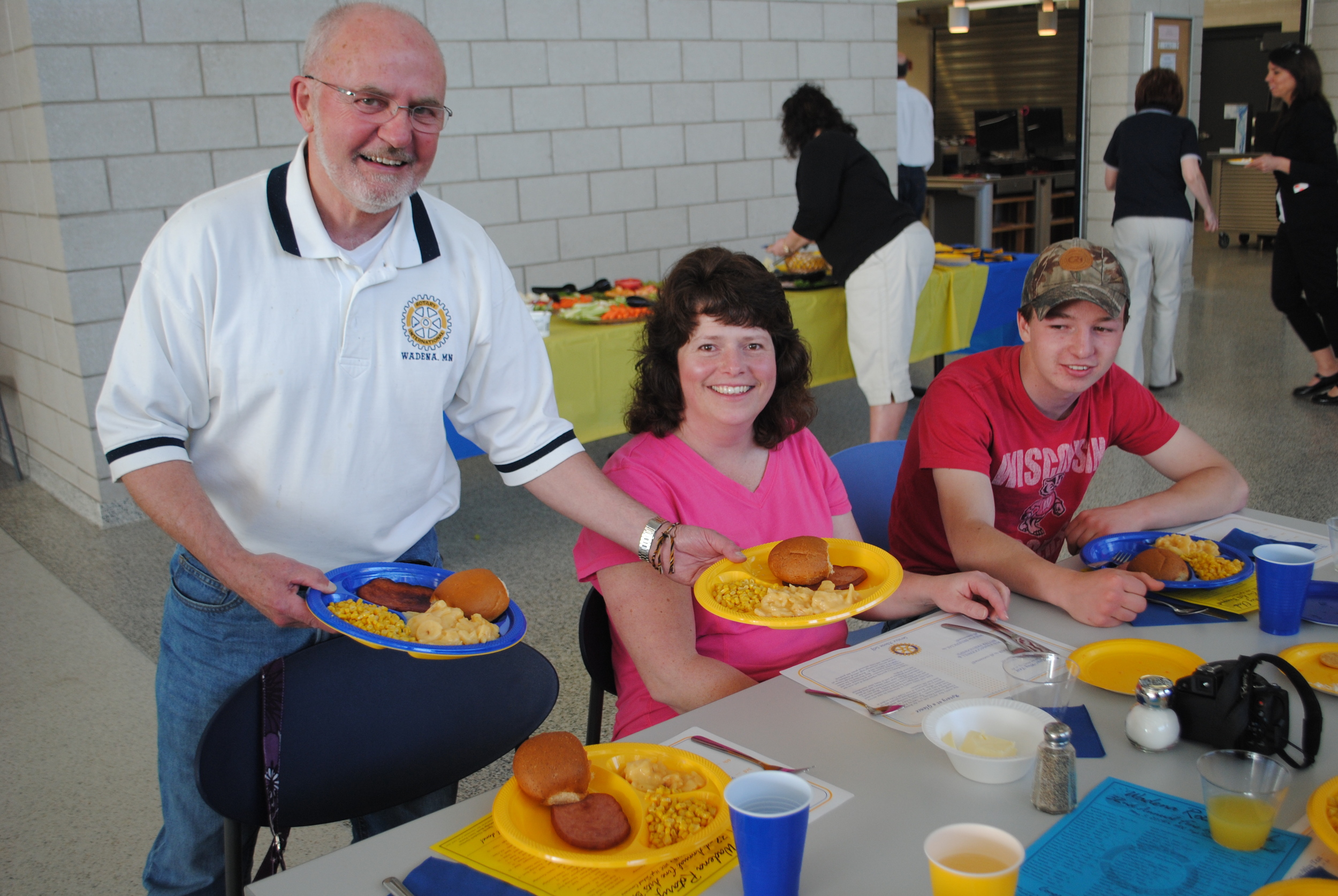 Wadena Rotarian Jerry Anderson serves WDC mom Gail Goeden her scalloped potatoes and ham dinner at the 32nd annual Wadena Rotary Club Fine Arts Banquet on May 5. Sitting next to Gail is her son, Jacob, a senior who was honored that evening. (Photos by Dana Pavek, WDC Schools)