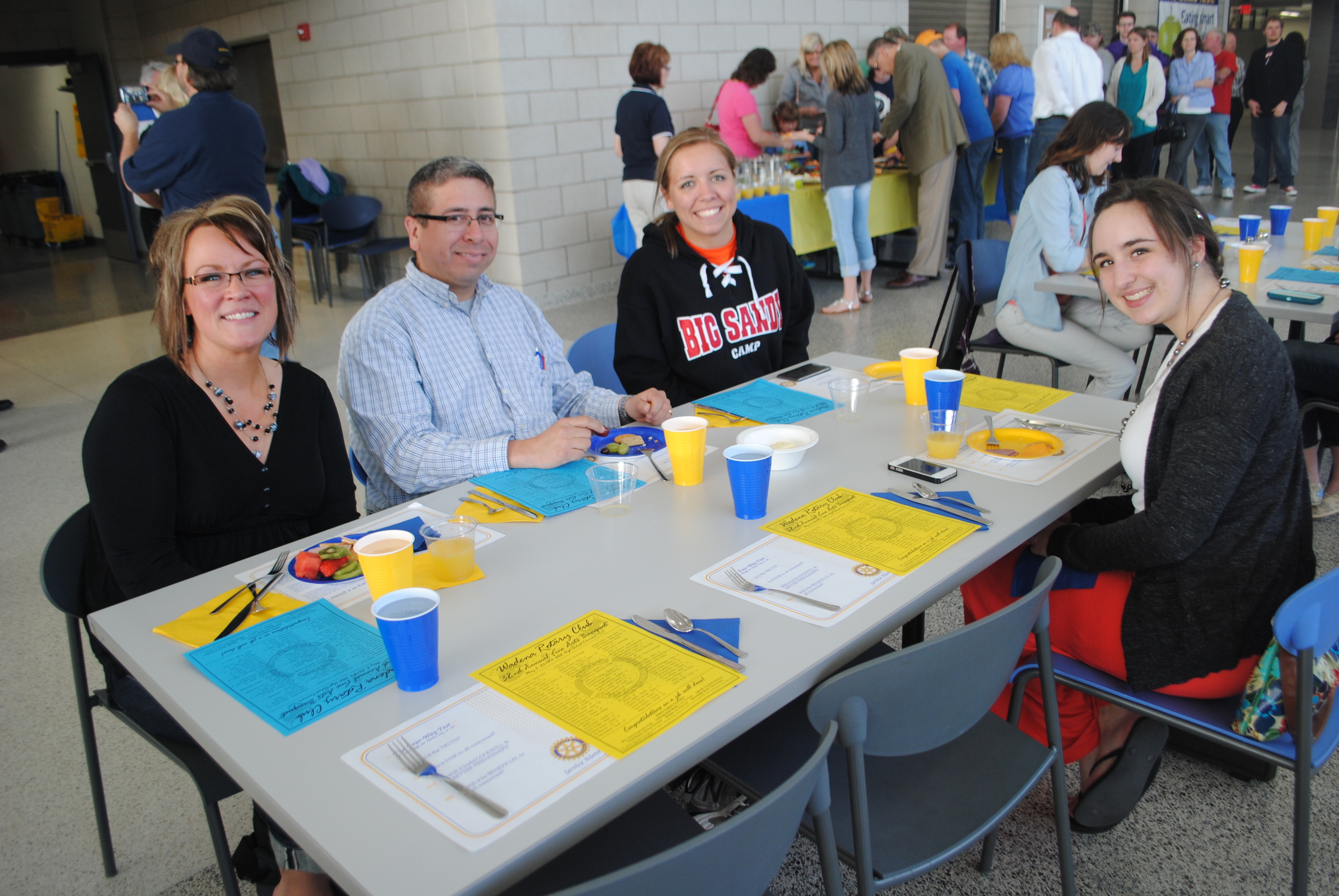 Enjoying time to visit prior to the fine arts banquet are, from left, Michelle and Vince Hinojos and their daughter, Maddy, a junior, and Brittany Andrews, a senior. The Wadena Rotary Fine Arts Banquet program took place in the Commons at WDC Middle/High School on May 5. 