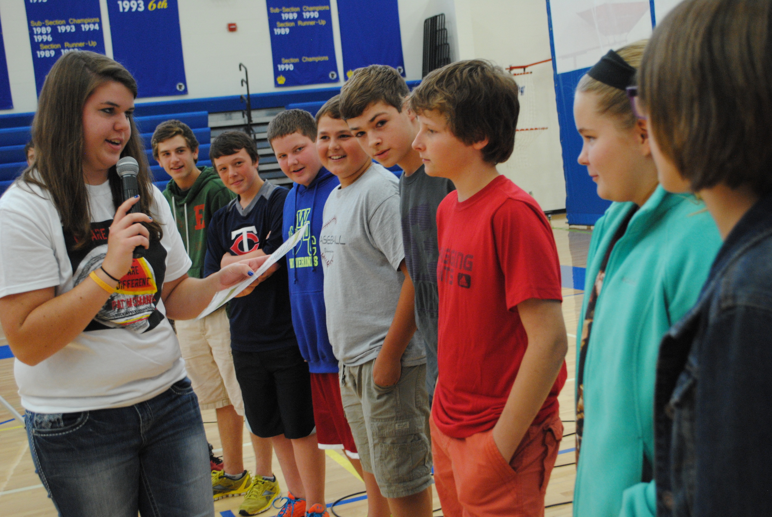 WDC High School mentor Jessica Wood leads a skit about assertiveness with a small group of junior high students. 
