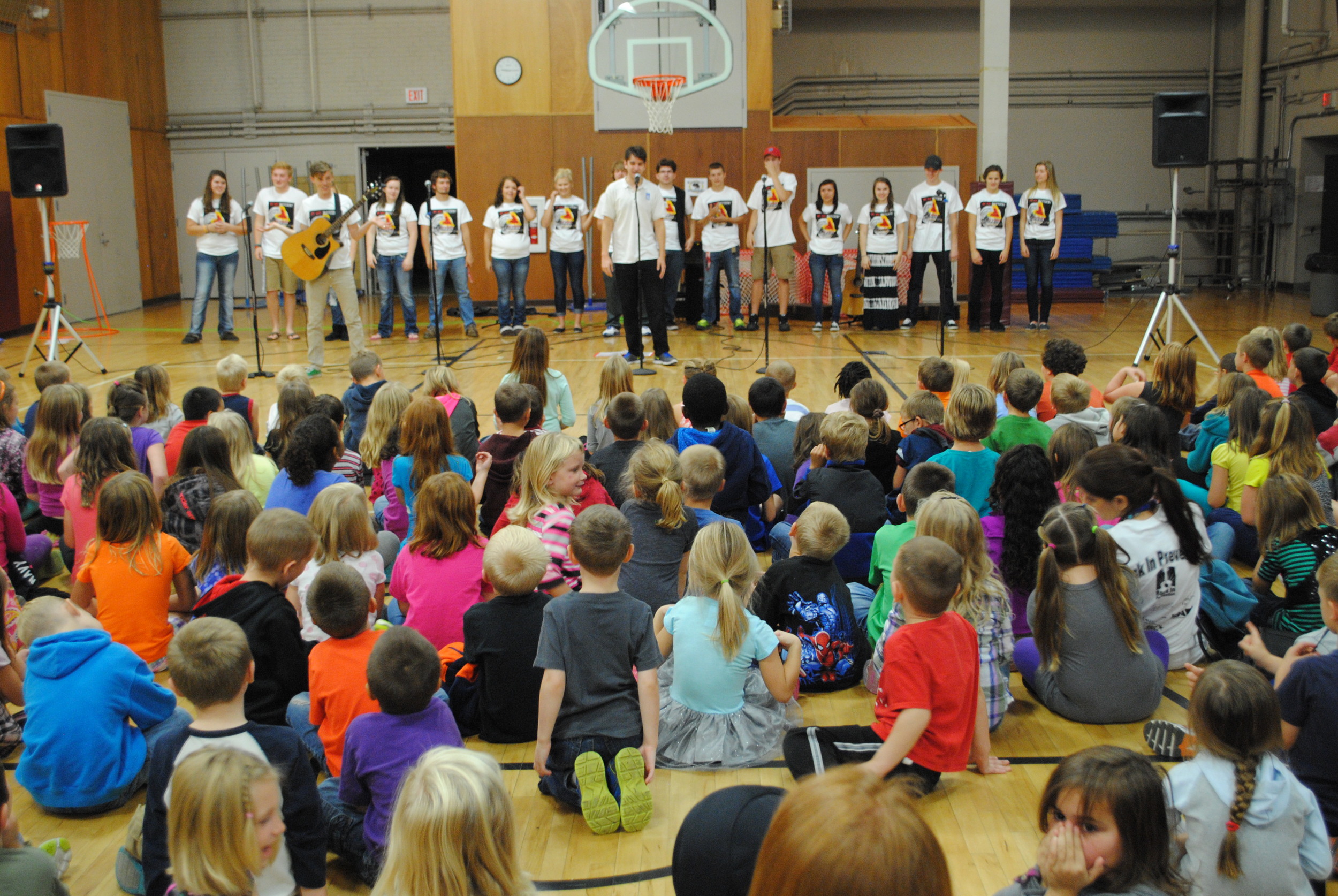 The Rock In Prevention program stopped by WDC Elementary and Middle/High School today (Sept. 18) to teach students skills and methods on how to stop bullying. Pictured above are kindergartners and second-graders listening to the presenters, Andrew and John, and helping out were WDC High School mentors. (Photos by Dana Pavek, WDC Schools)