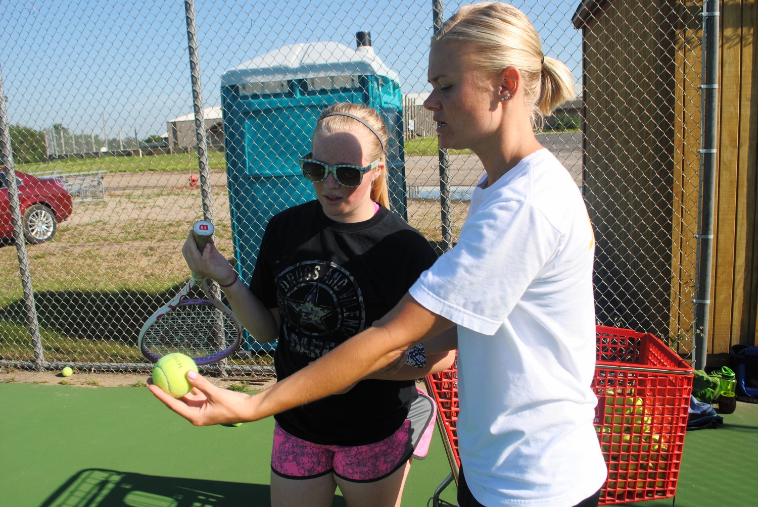 Coach Wahlin giving Sarah Moen pointers at practice. (Photo by Dana Pavek, WDC Schools)