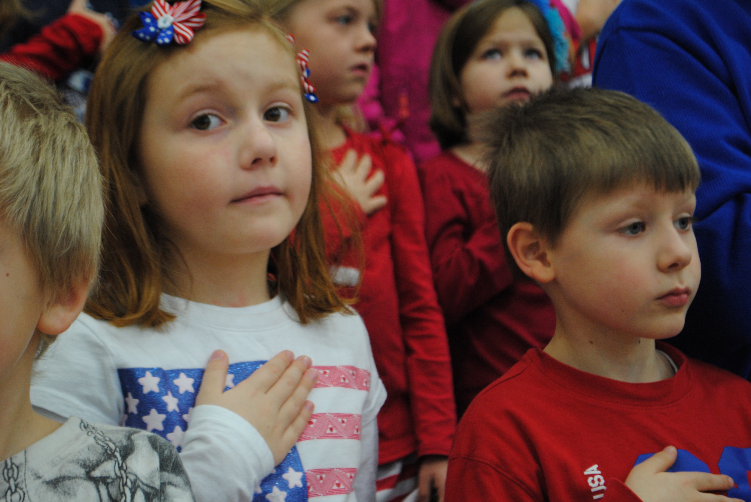 WDC Kindergarten students Emma Weniger and Johnathan Hockert put their hands over their hearts during the Pledge of Allegiance at WDC Veterans Day program held today at WDC Middle/High School Gym. WDC’s Veterans Day program teaches WDC students the importance of patriotism and gratitude for veterans. (Photos by Dana Pavek, WDC Schools)