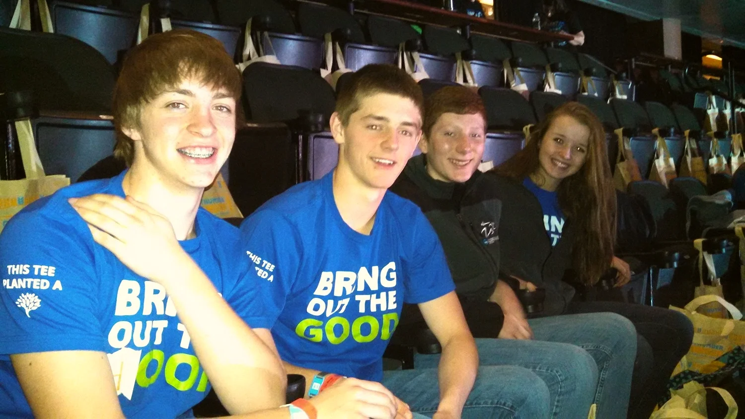 Waiting for the We Day rally to begin this morning are WDC students, from left, Jarrett Pettit, Austin Sutherland, Ryan Olson and Lauren Soroko. (Photo by Rachel Bounds.)