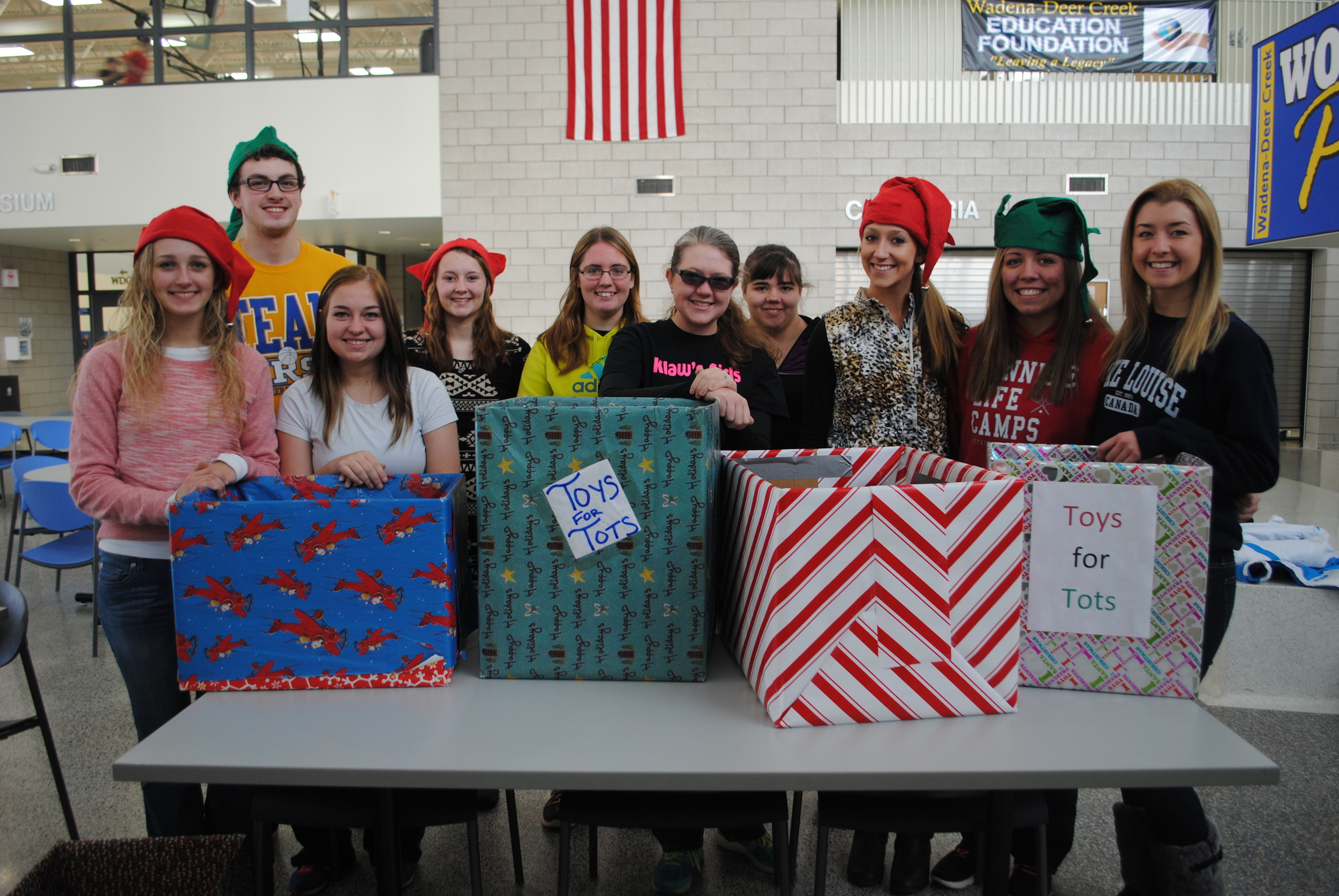 Preparing for the Toys for Tots Drive are BPA members, from left: Marissa Jahnke, Matthew Quincer, Kylie Lupkes, Jessica Langer, Ashley Peters, Elise Kallevig, Tabetha Baker, Danyel Post, Maddy Hinojos and Carrie Nelson. Not pictured: Anna Kraemer. (Photo by Dana Pavek, WDC Schools)