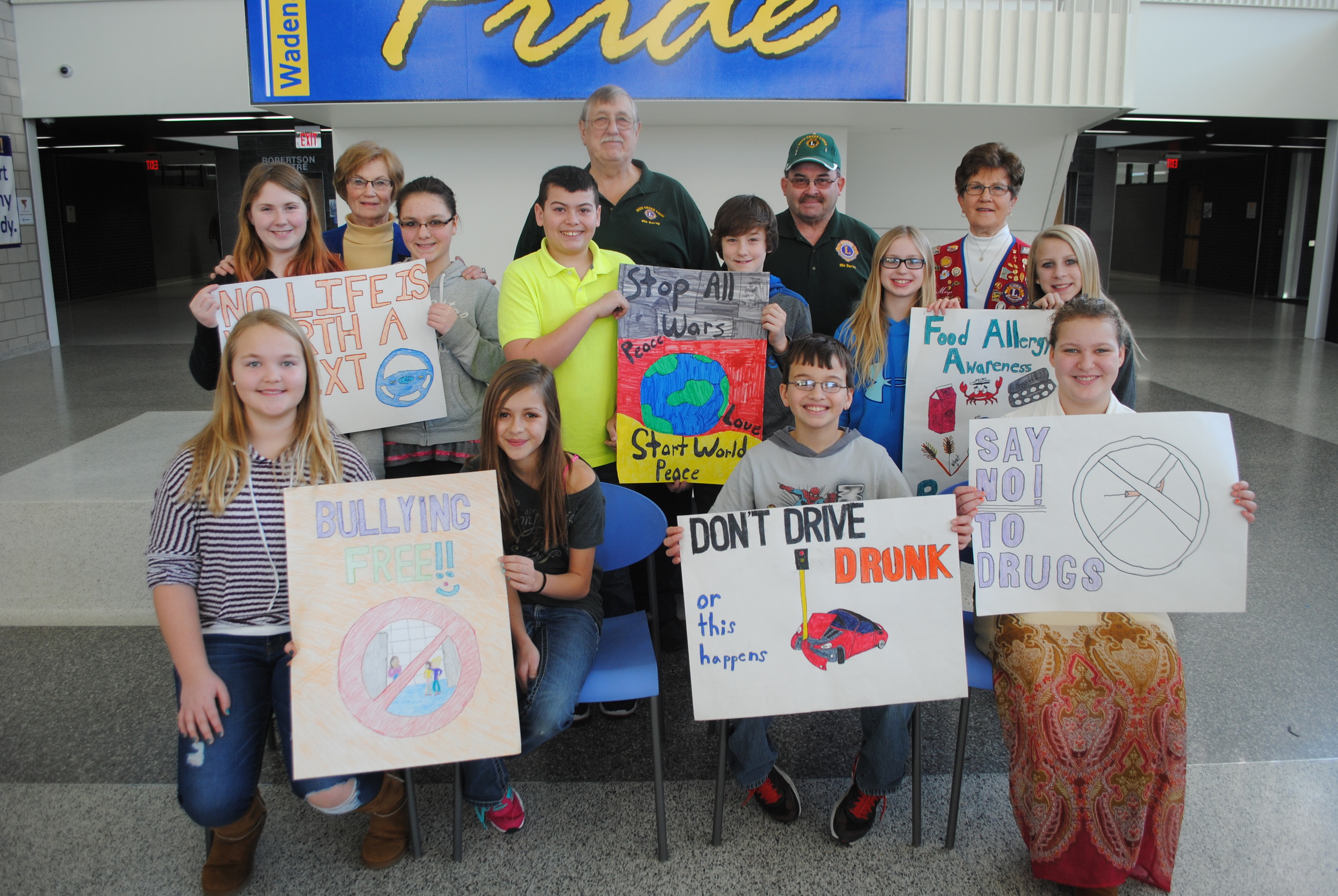 The Bluffton, Deer Creek and Wadena Lions clubs recently awarded the winners of their annual poster contest. Pictured, back row, from left: Wadena Lions poster winners Kylie Matthews and Joslynn Judd with Nellie Wegscheid, Wadena Lions representative; Deer Creek Lions poster winners Zach Shaw and Kade Woods with Larry Spenst and Lance Wohlwend, Deer Creek Lions representatives; and Wadena Lions poster winners Emma Mehl and Teagan Roberts with Marge Harrison, Bluffton Lions rep and Poster Contest coordinator; front row, from left: Nevada Schulz and Allyson Swenson, fourth place; Ben Albright, fifth place; and Katelyn Gardner, sixth place. (Photo by Dana Pavek, WDC Schools) 