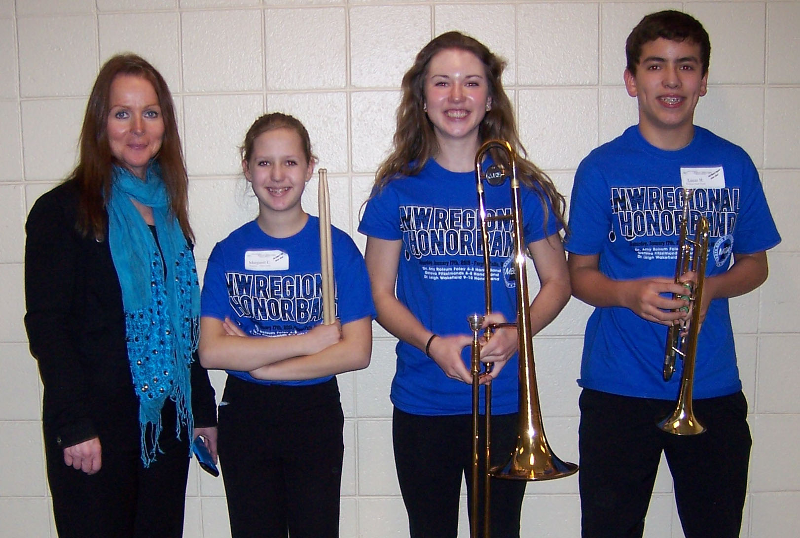 Grades 6-8 Blue Band featured WDC students, second from left: Maggie Carlson, Sophia Kreklau and Lucas Hinojos, and far left, Geneva Fitzsimonds, Band Director from Southview Middle School, Edina. (Photo courtesy of MBDA)