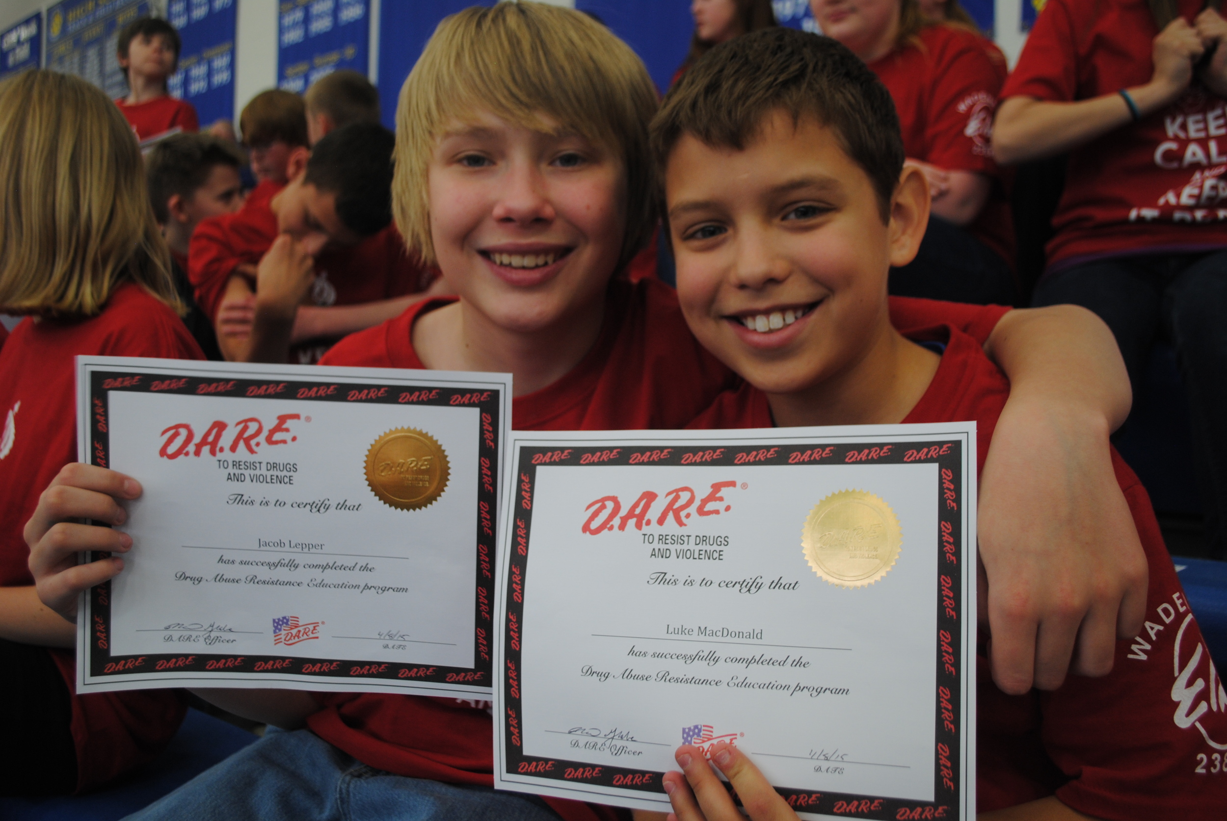 Jacob Lepper and Luke MacDonald proudly show their D.A.R.E. graduation certificates at the ceremony.