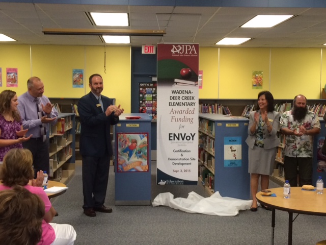 NJPA made the announcement Thursday morning to Wadena-Deer Creek Elementary staff and administration that Wadena-Deer Creek Elementary was awarded funding to serve as an ENVoY certification and demonstration site. Pictured above at the unveiling of the ENVoY banner, from left, Tracy Fruechte, first-grade teacher; Louis Rutten, elementary principal; Paul Drange, NJPA Director of Regional Programs; Rynell Schock, NJPA Leader of Education Services; and Dan Savoie, third-grade teacher. 
