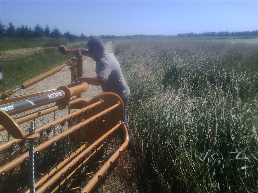 Ethan Benson adjusts a twin-basket rake for his Diversified Agricultural Production Placement Proficiency on his home farm, Benson Dairy. Courtesy photo.