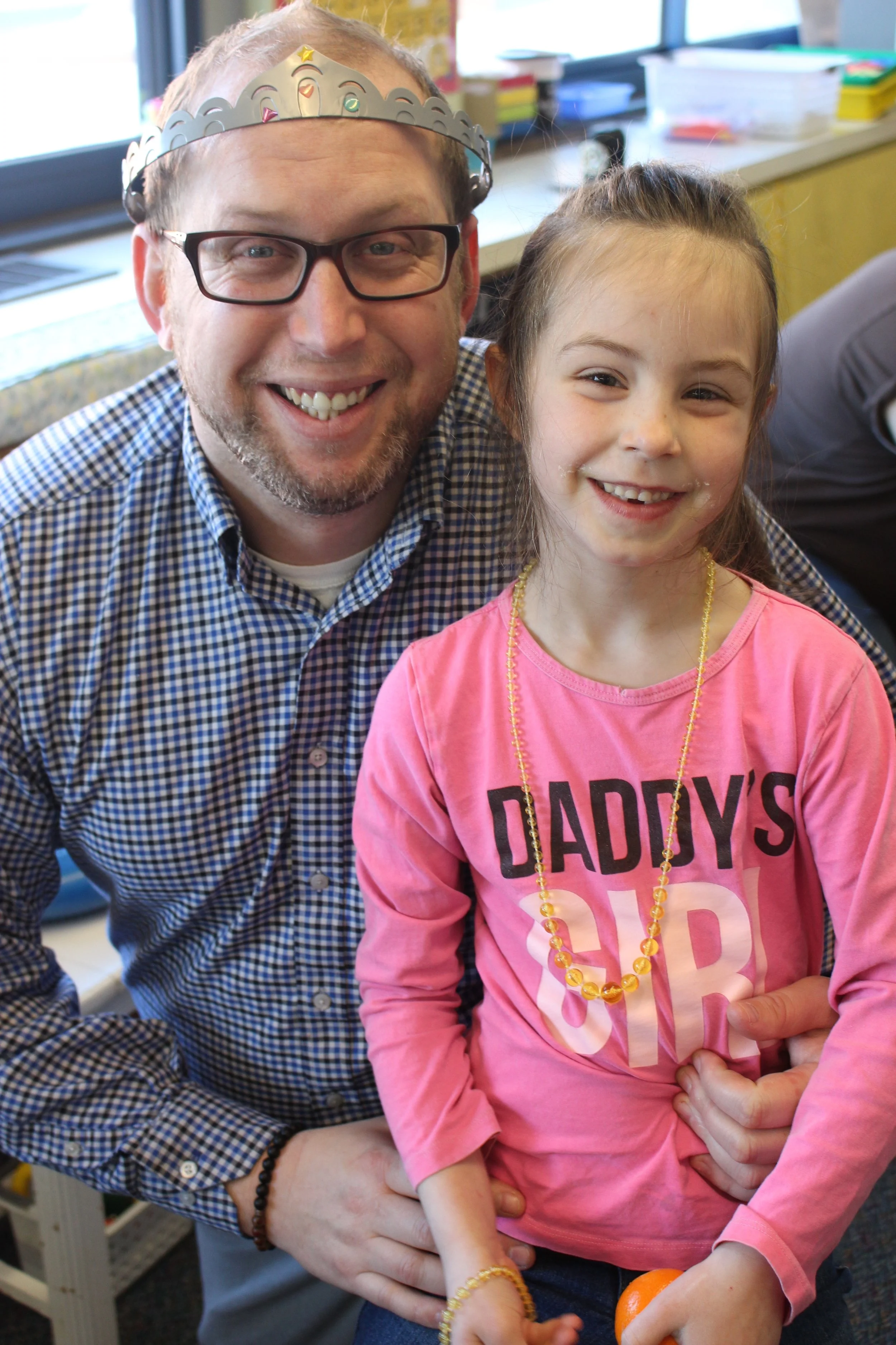 Dads like Ryan Damlo, left, and his daughter, Kylie, played board games, colored pictures, made art projects and more during "Donuts for Dads."