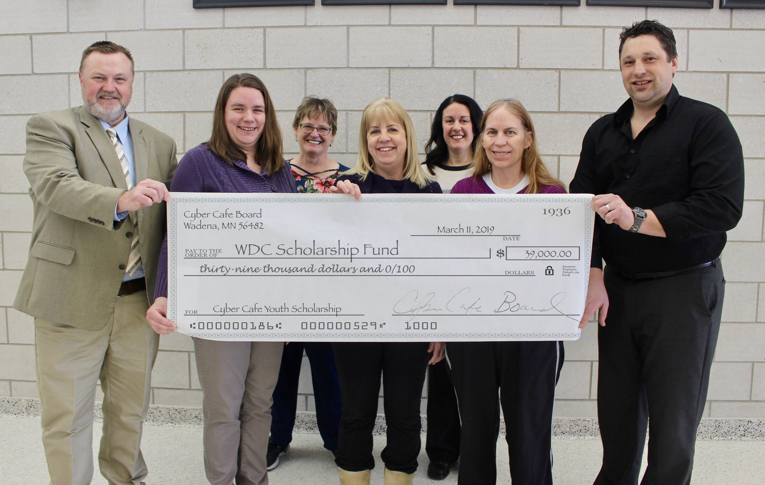At the presentation of the Cyber Cafe's $39,000 endowment included members of the Cyber Cafe Board and Wadena-Deer Creek school representatives, from left: WDC Supt. Lee Westrum, WDC Counselor Toni Kraska; and Cyber Cafe Board members Cindi McCullough, Kathy Yelle, Stephanie Drange, Ann Pate and Randy Jahnke. Photo by Dana Cantleberry, WDC Schools.