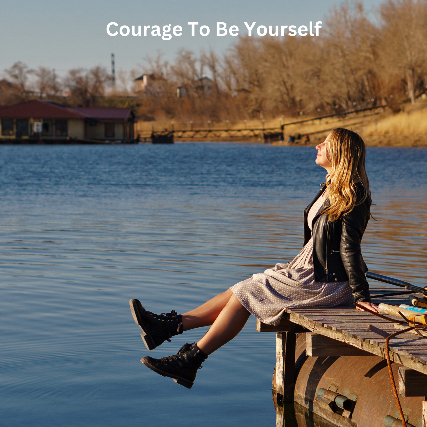 woman sitting in the sunshine with a smile by the water