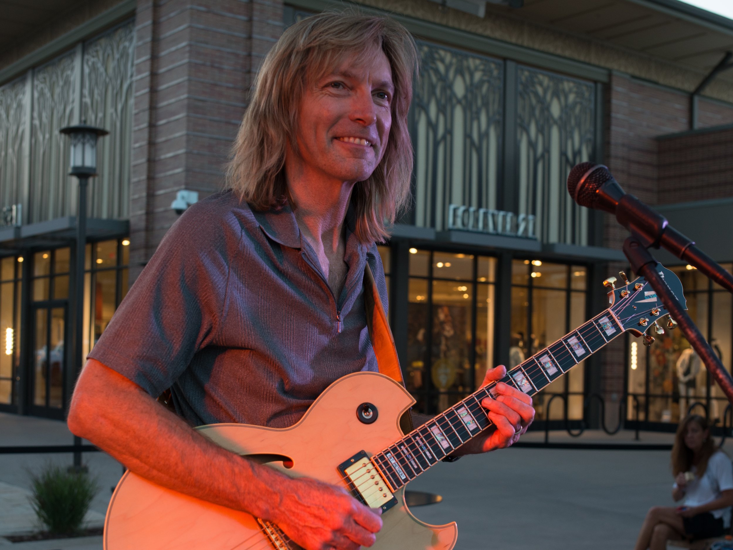    Bill Sickles performing solo guitar at The Orchard Town Center in Westminster Colorado   