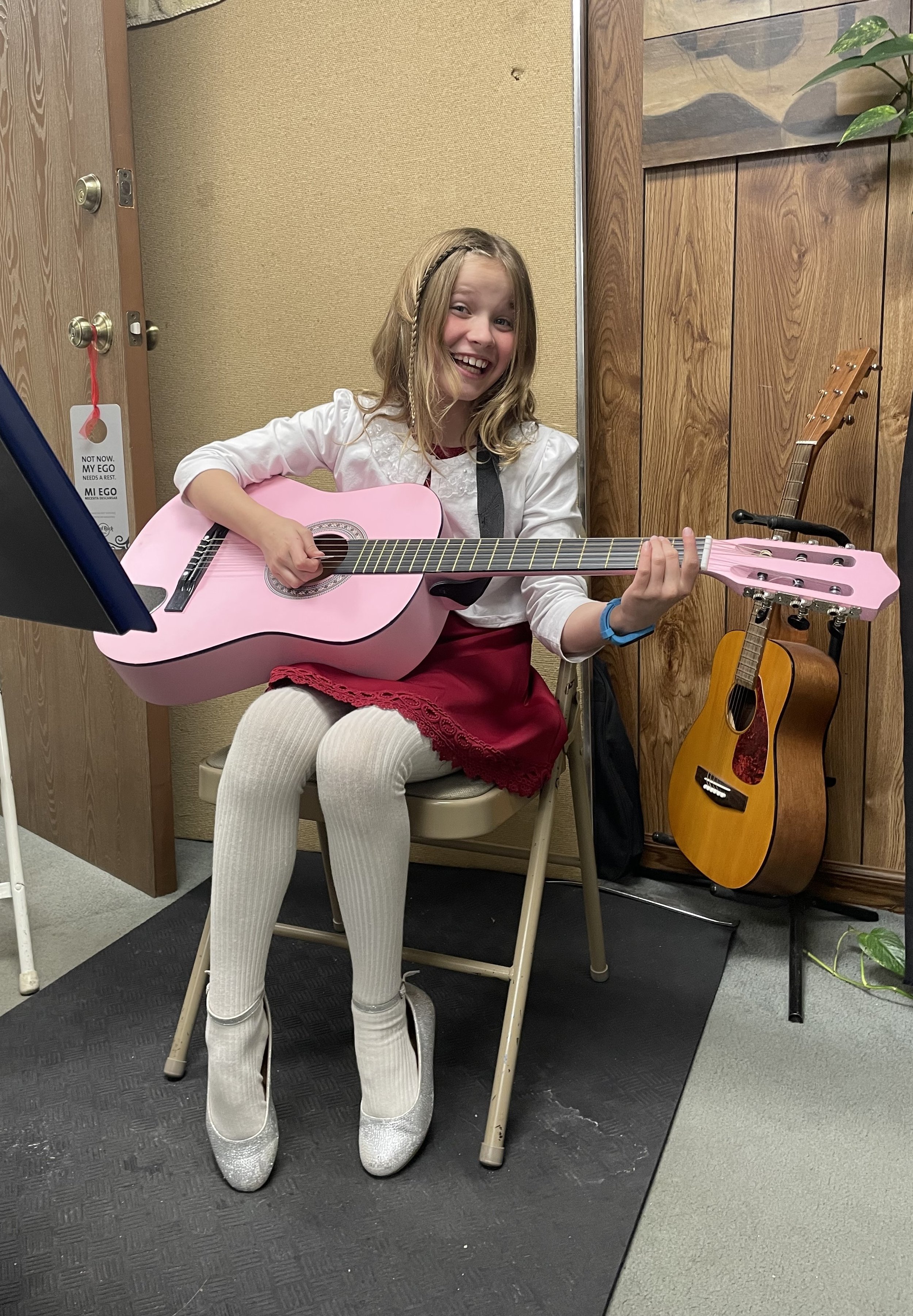 young female guitar student