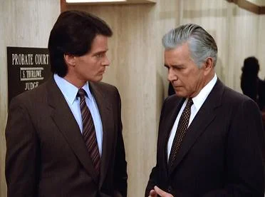 Blake sucks up to his lawyer before the farce begins.