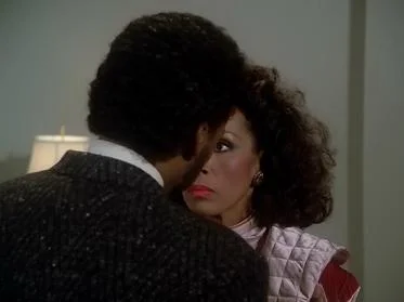 Dominique looks so thrilled that Nick is about to kiss her