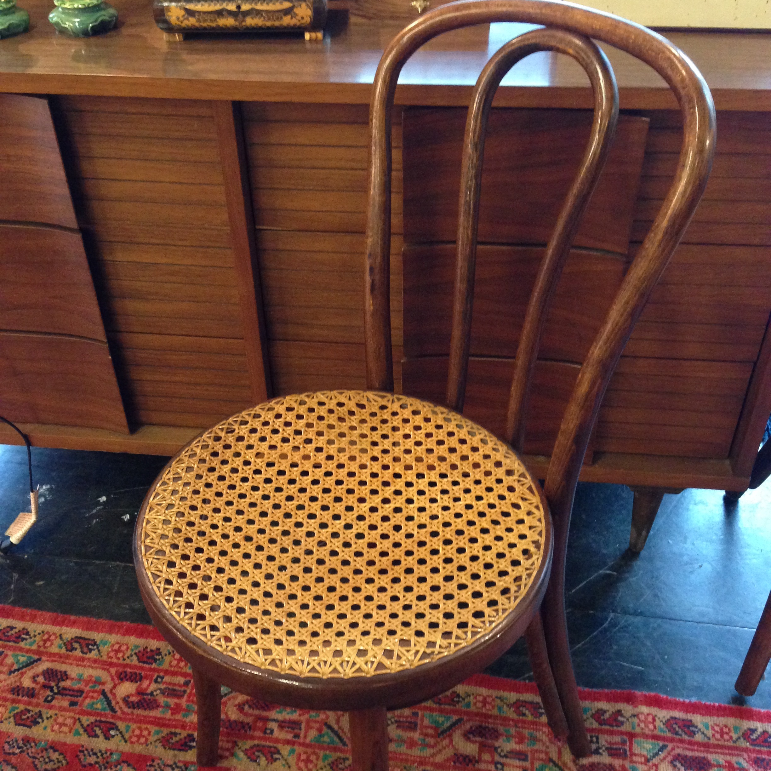 bent back caned chair