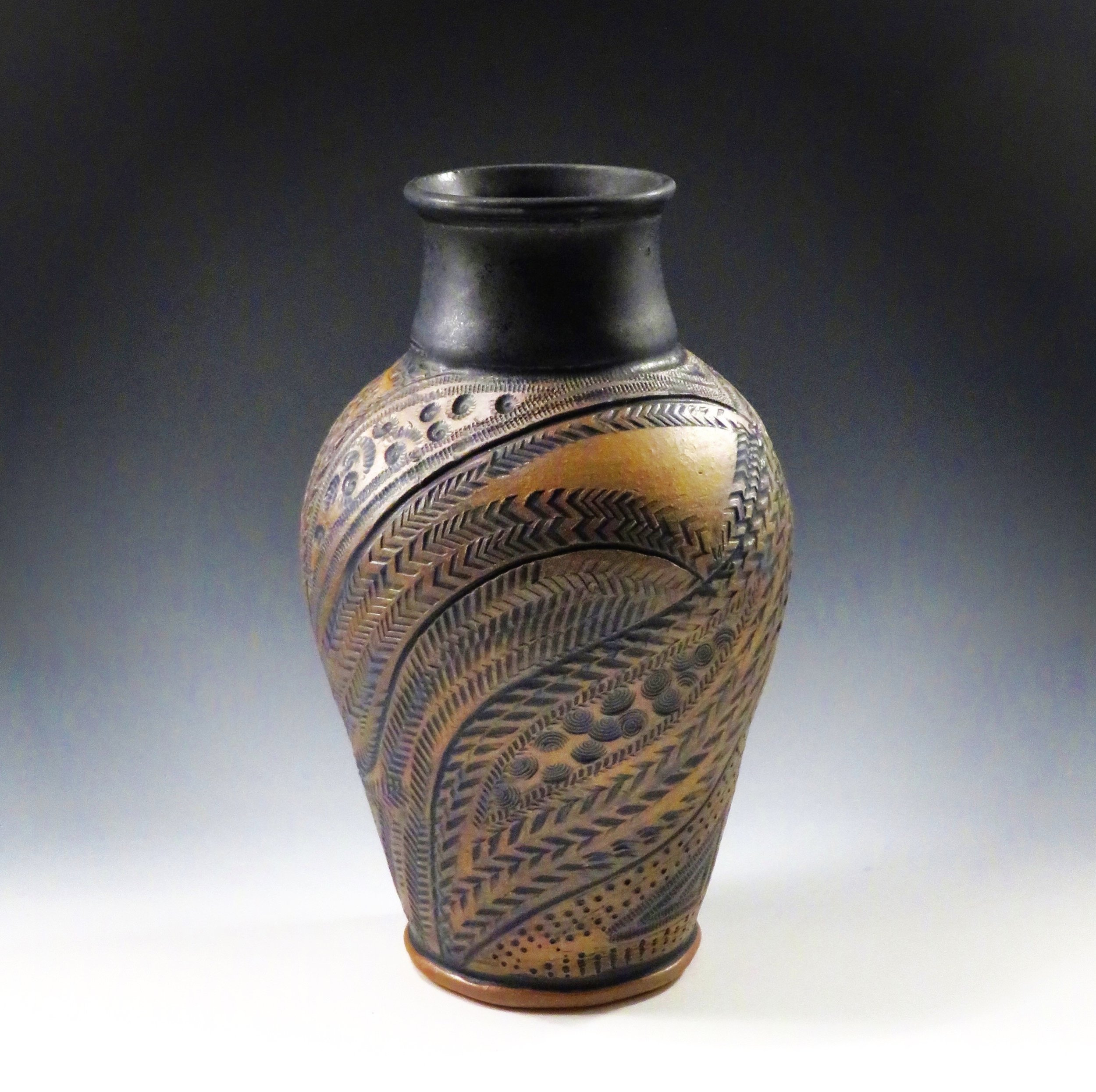 Brown/ black vase, carved and stamped