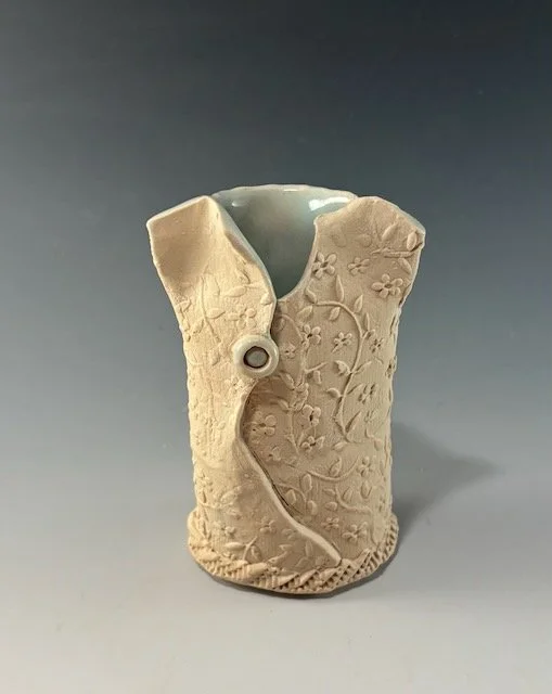 White mini dress vase 4”x2” wide with celadon lining. Hand built ,stamped stoneware.