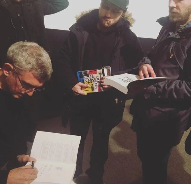 Signing books during my visit to Vilnius. Pic posted on instagram by opiumvilnius. — with Arturas Mamania.