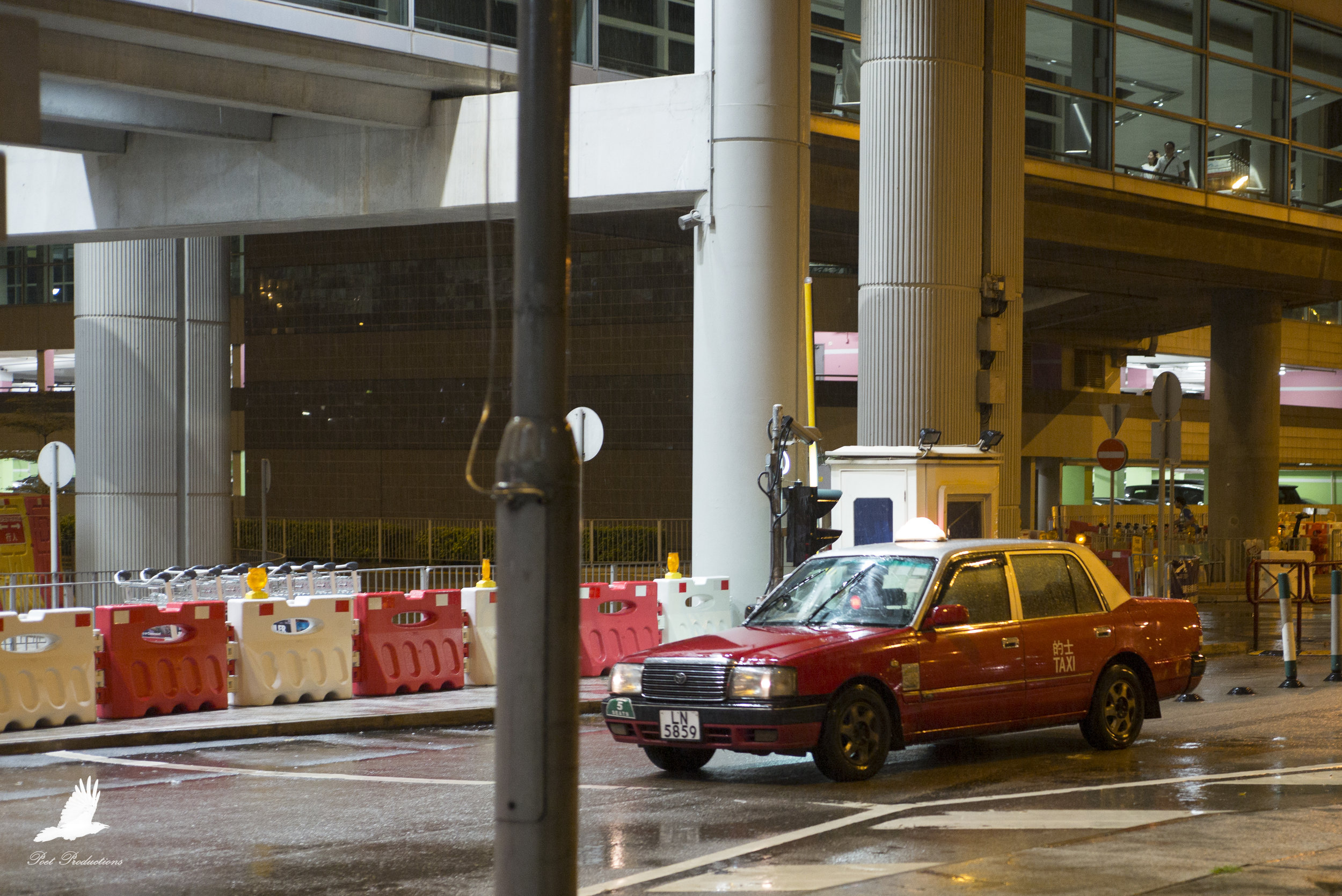 A taxi arrives at Hong Kong Airport