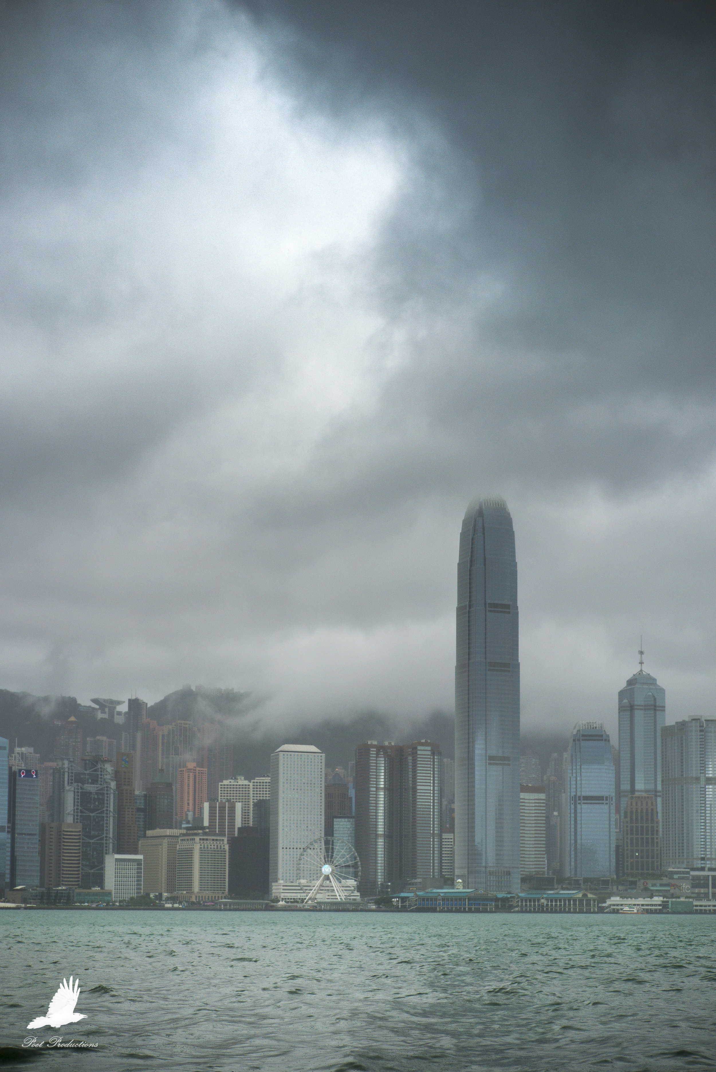 The strong winds pick up and move the clouds enough for some light to peek through the clouds.