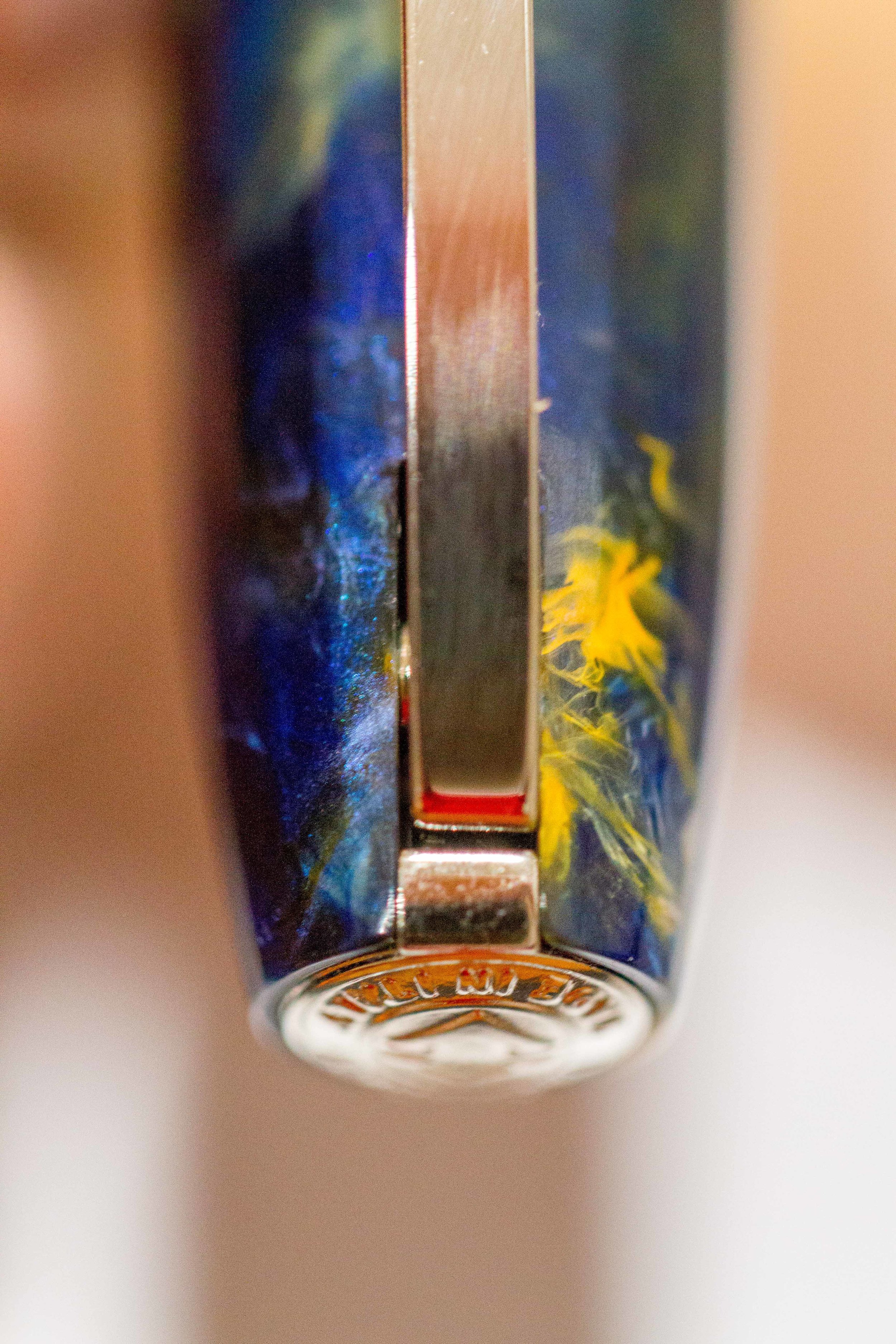 Above: Here the pen clip is centred. Note how the spring in the mechanism seems to be very strong on one side, pushing on one side of the hinge causing the clip to point to one side