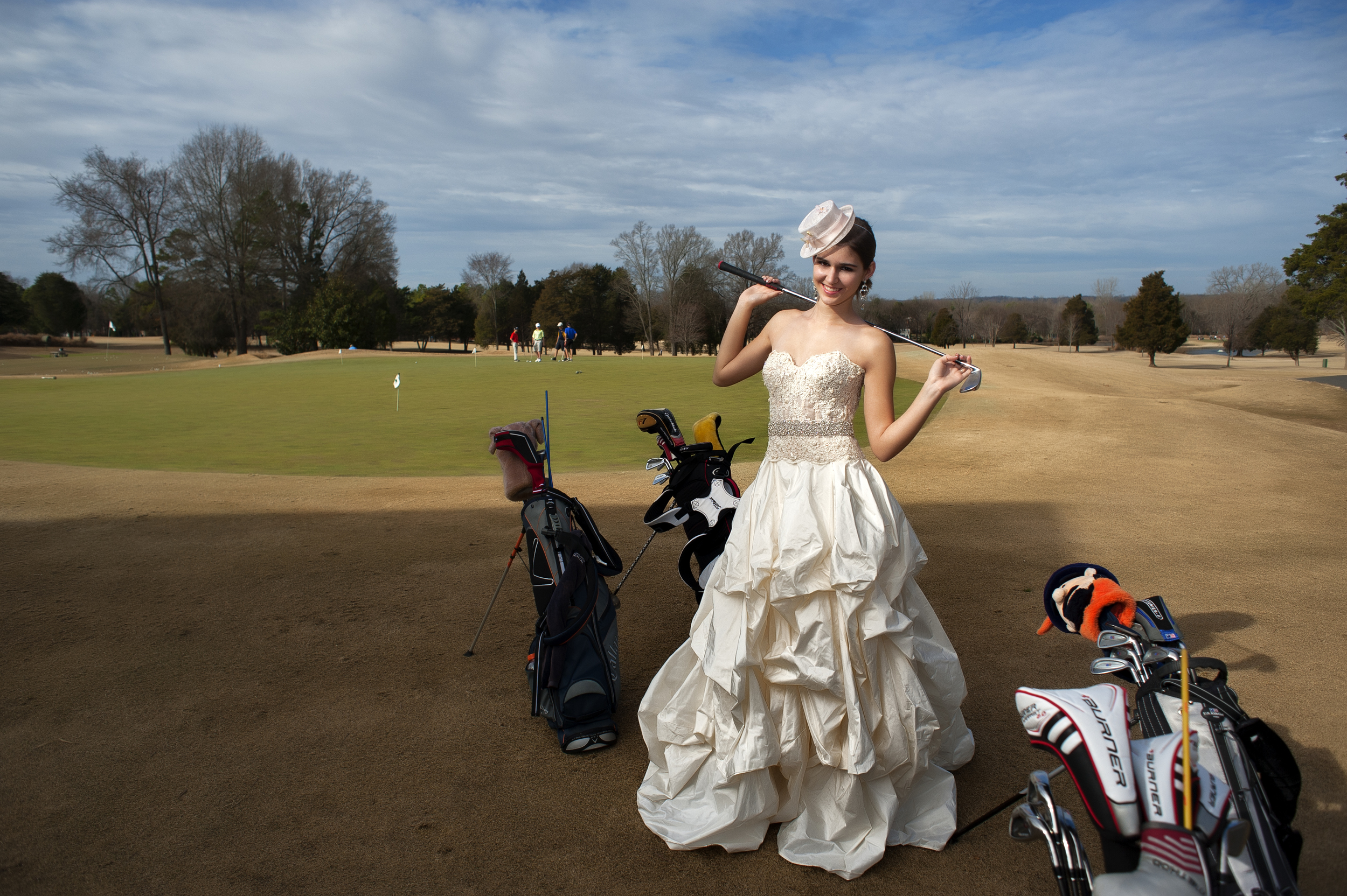 Bride on a Golf Course by Hampshire Wedding Photographers, Kenneth Light Studios - Peter Farrar
