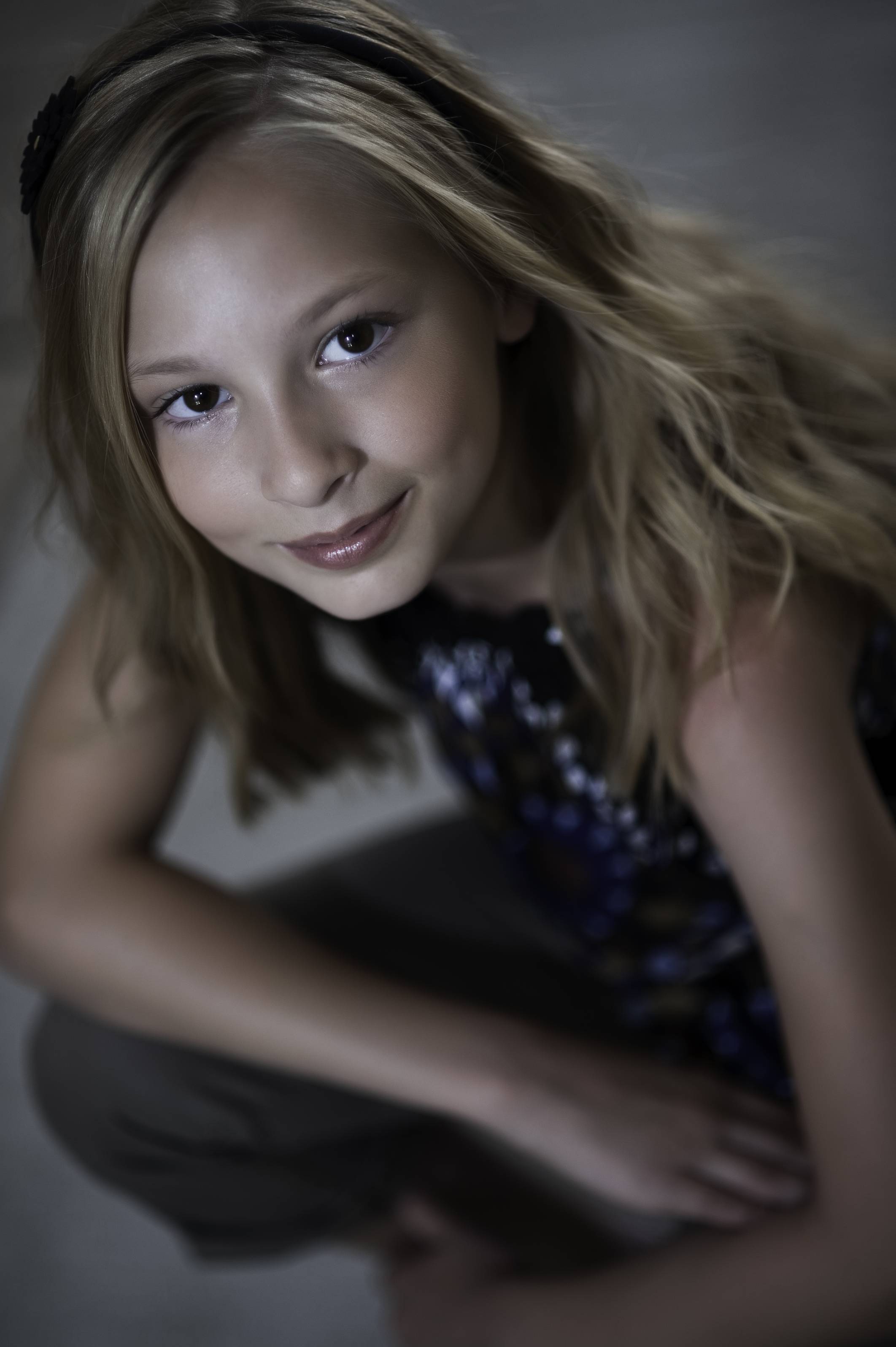 A child actress poses for a portrait - Peter Farrar