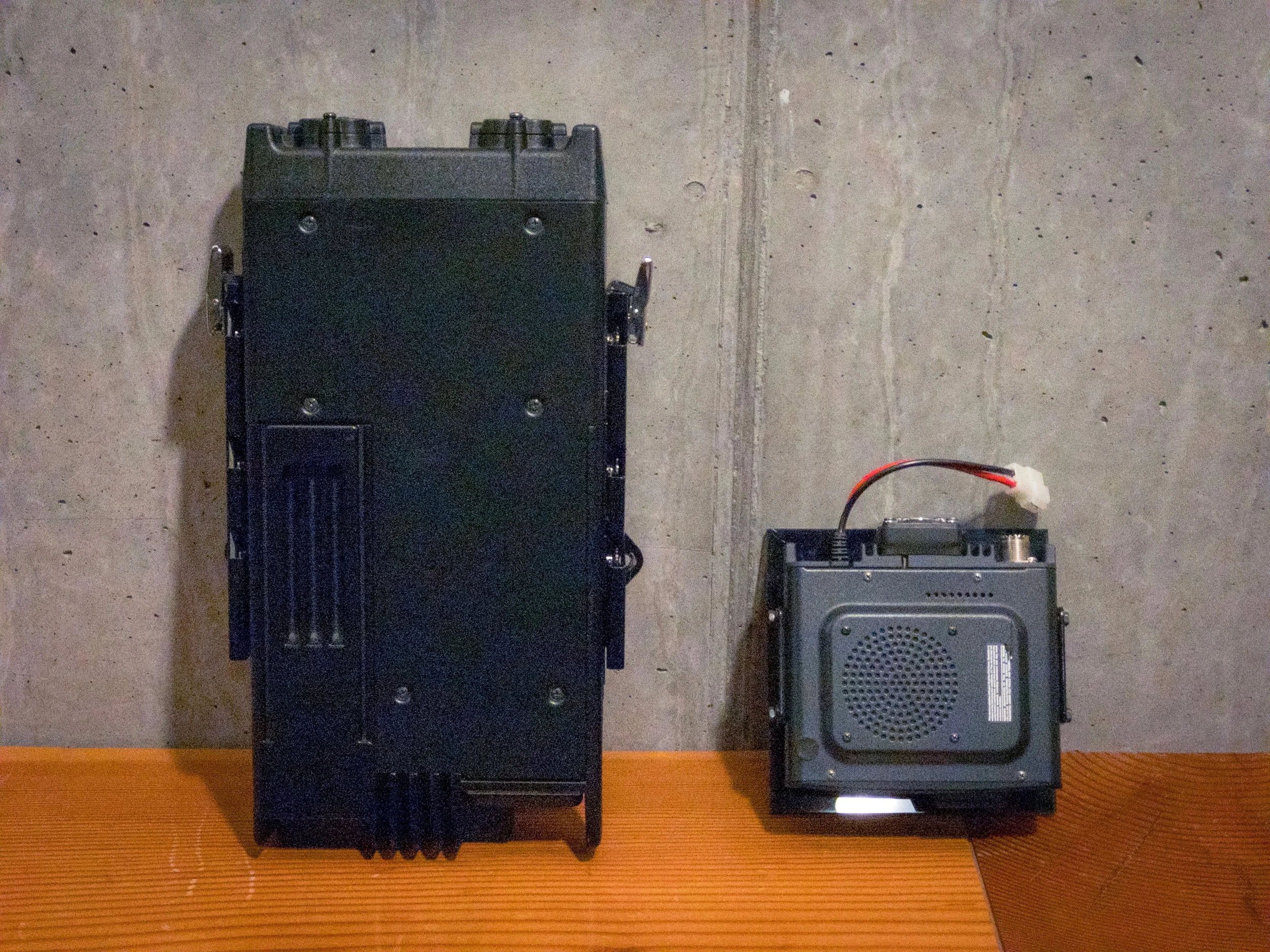 Size comparison between the base units of the Kenwood VHF radio, and Yaesu Ham radio, respectively.