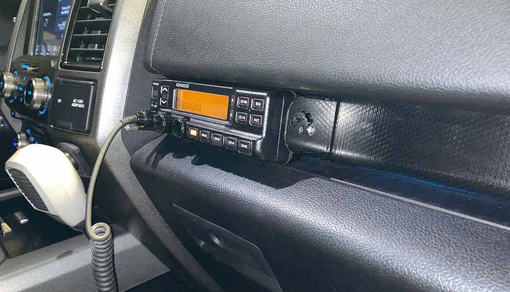 Kenwood head unit hard mounted into the cubby above the glove box on my 2018 Ford Raptor SuperCrew.