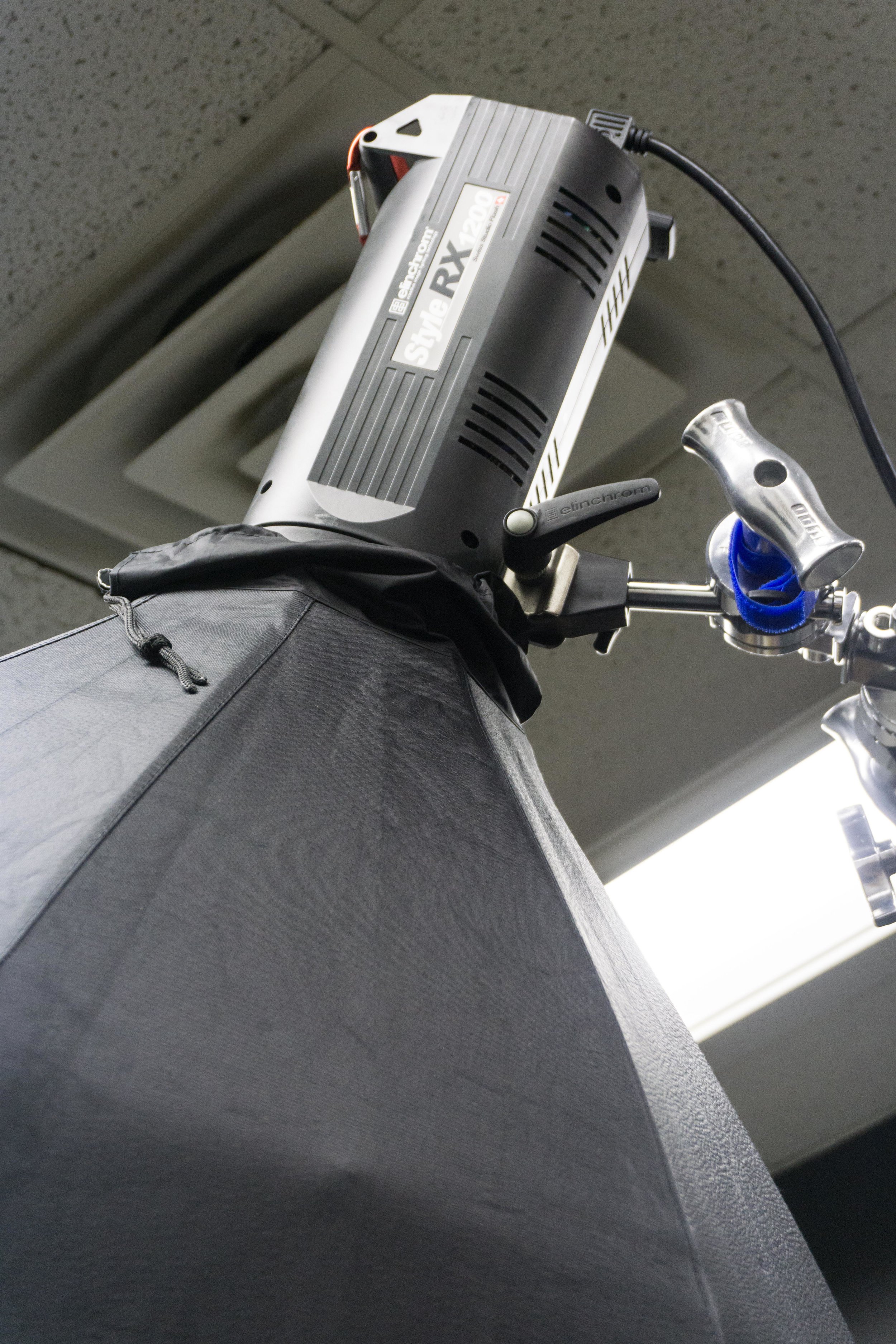 Only about 1' from my ceiling. You really need a trigger that allows you to adjust the light power without having to lower it constantly.
