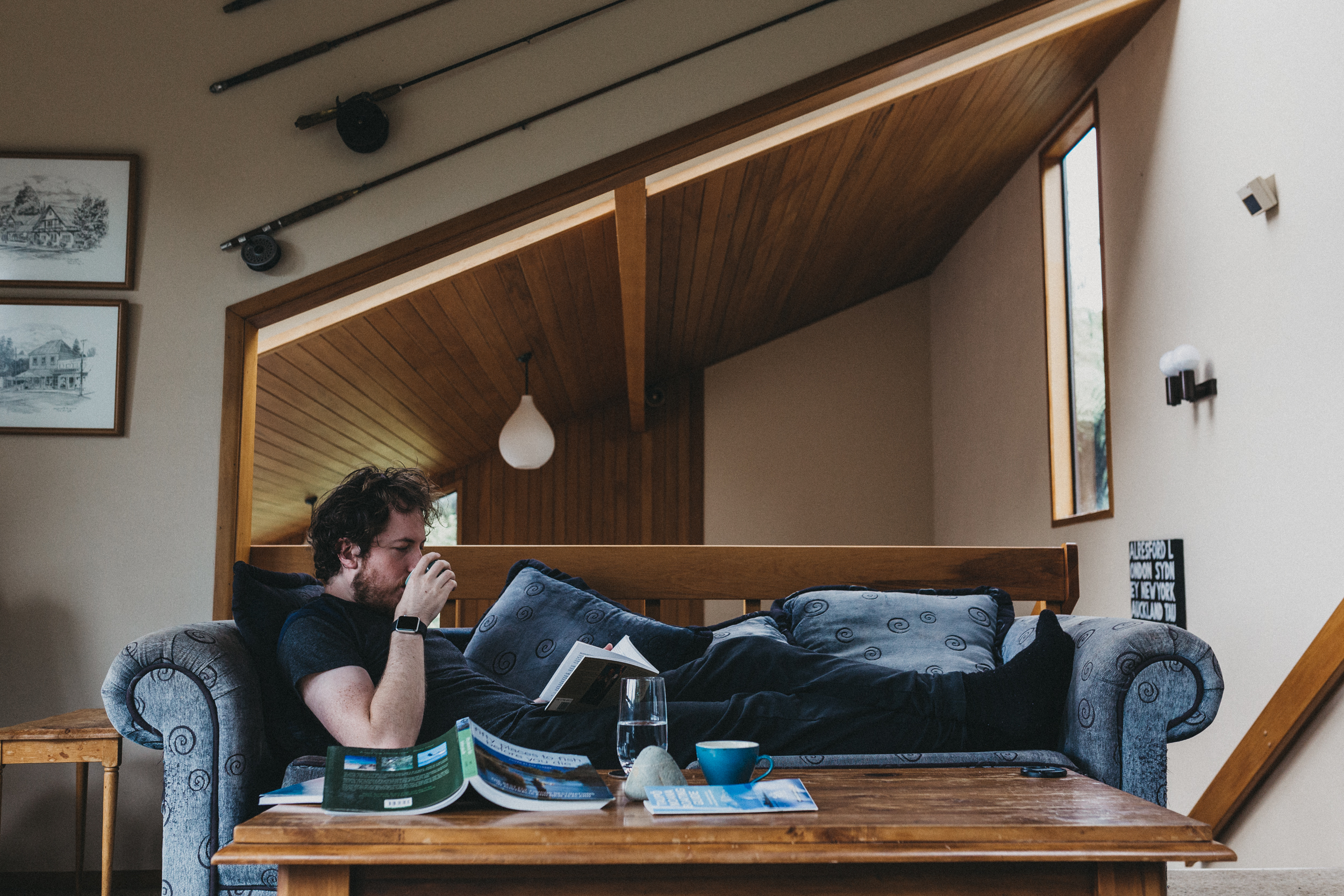 Day Two: Nick caffeinating and reading about the local trout fishing history in the neighbouring fishing village of Turangi.