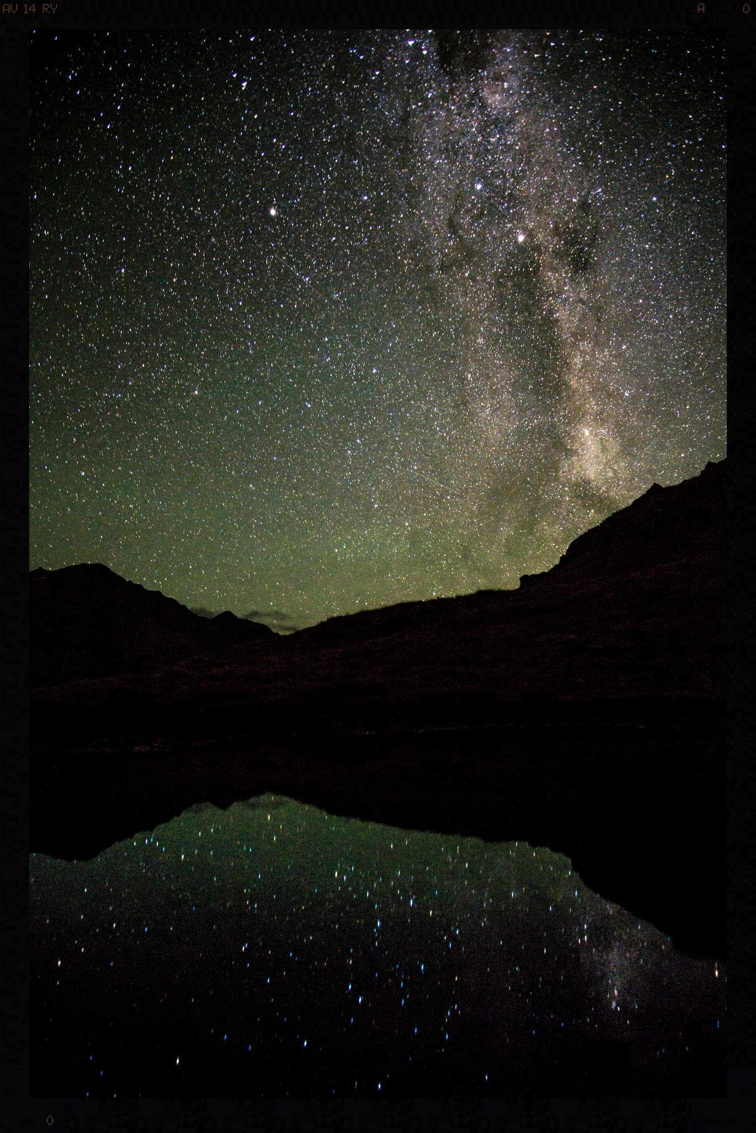 Milky way reflected in tarn on Serpentine Range