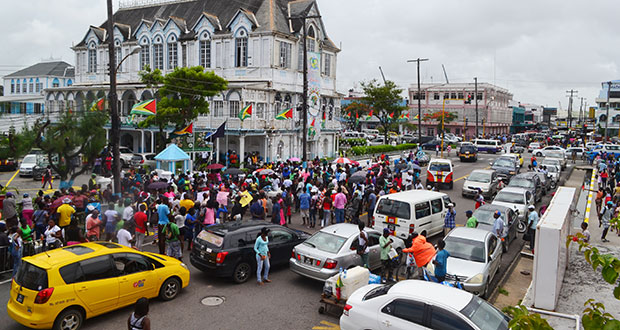 Workers protest outside City Hall