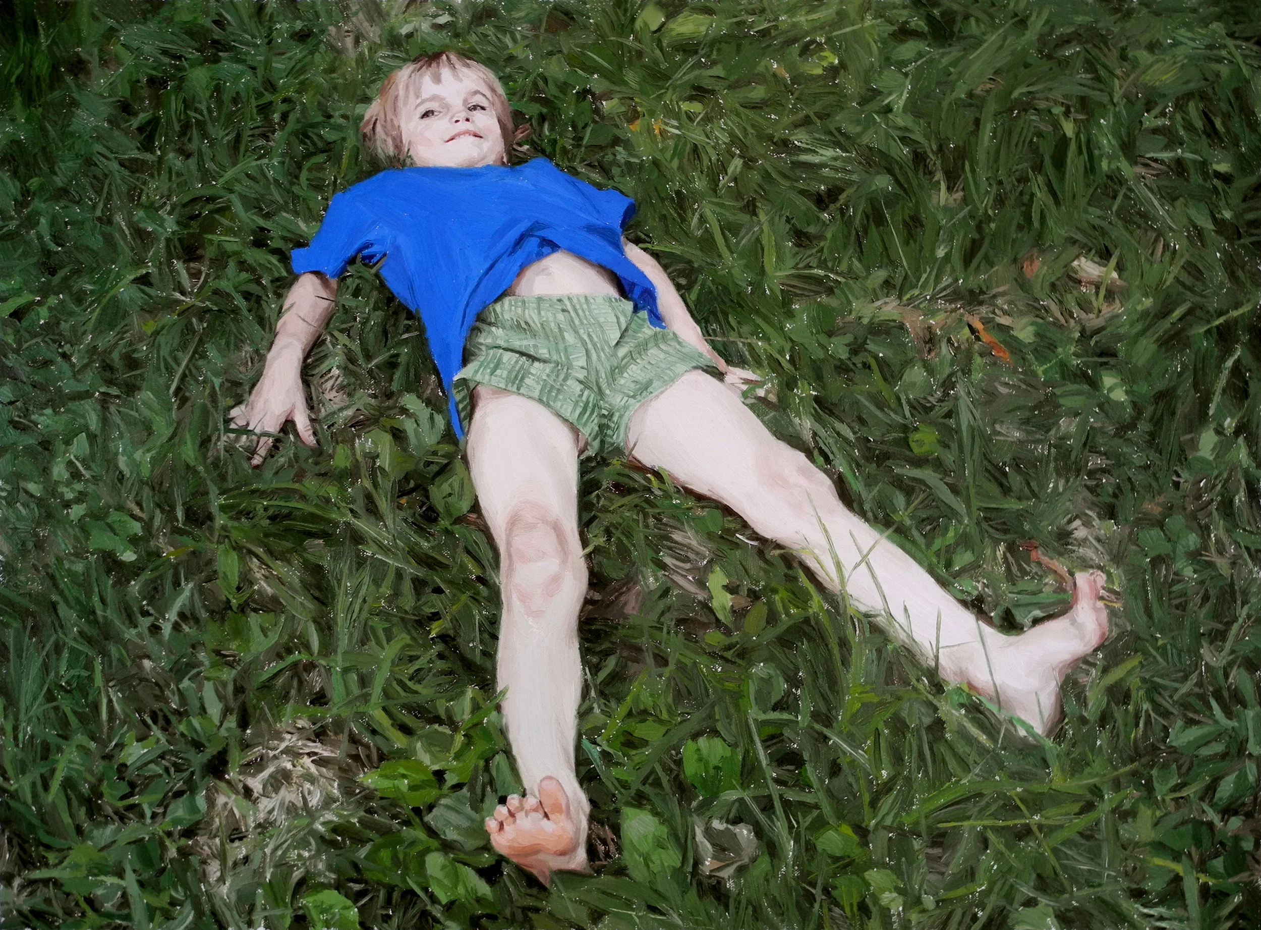 BOY LAYING IN GRASS