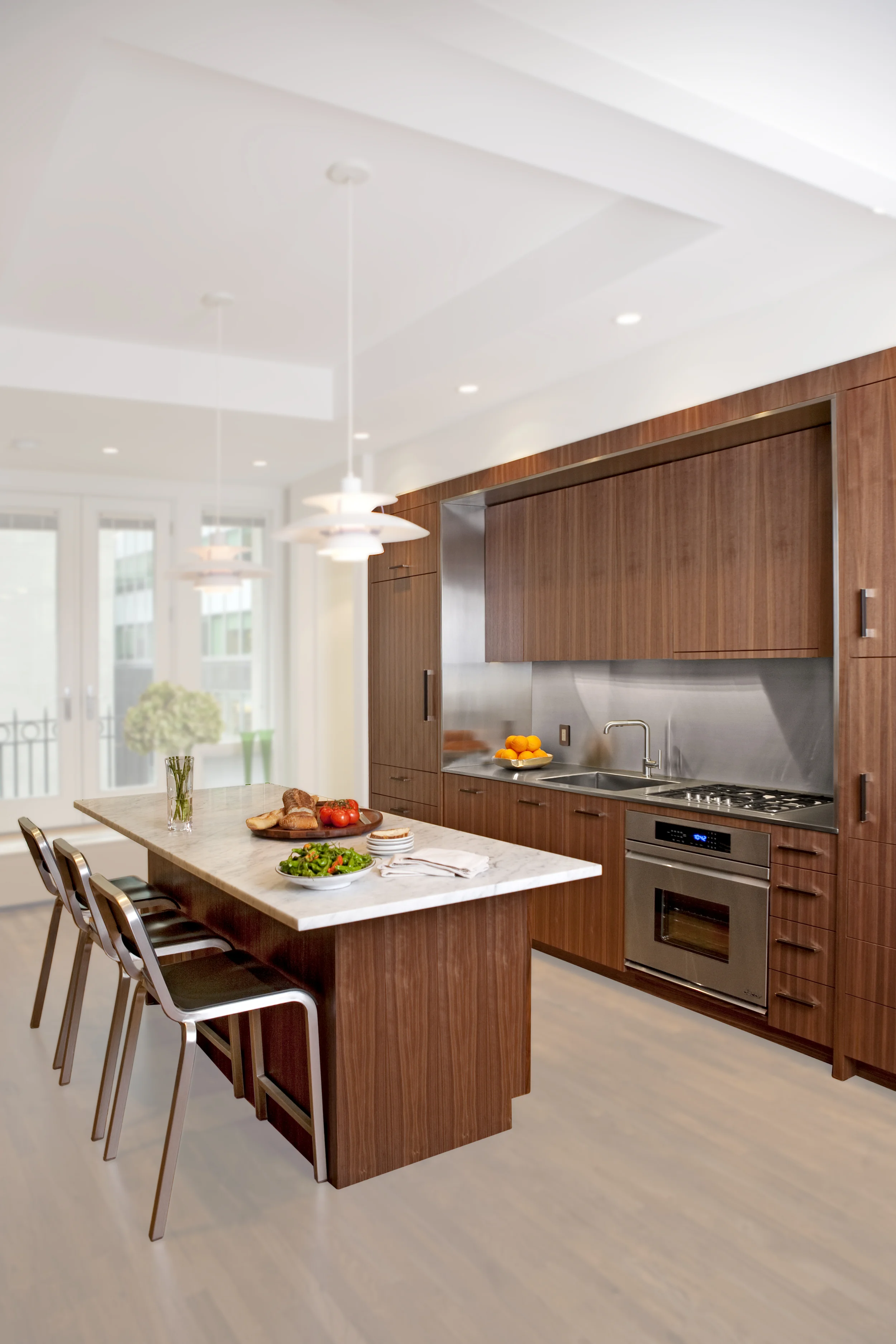 Quarter-sawn walnut veneer and stainless steel kitchen