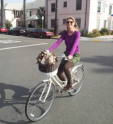 Me on my brand new bike! Note I've coordinated my outfit to my bike for my first outing on her.