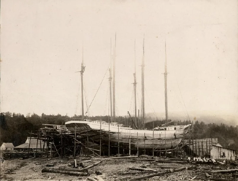 This photo is of the Meredith White under construction in Alma in 1918. The Meredith and its sister ship the Vincent (seen behind the Meredith) were built for C.T. White & Son Ltd. Note the scaffolding around the ships used by the men while building the vessel. Although the deck and the masts are in place the planks on the hull have yet to be painted.