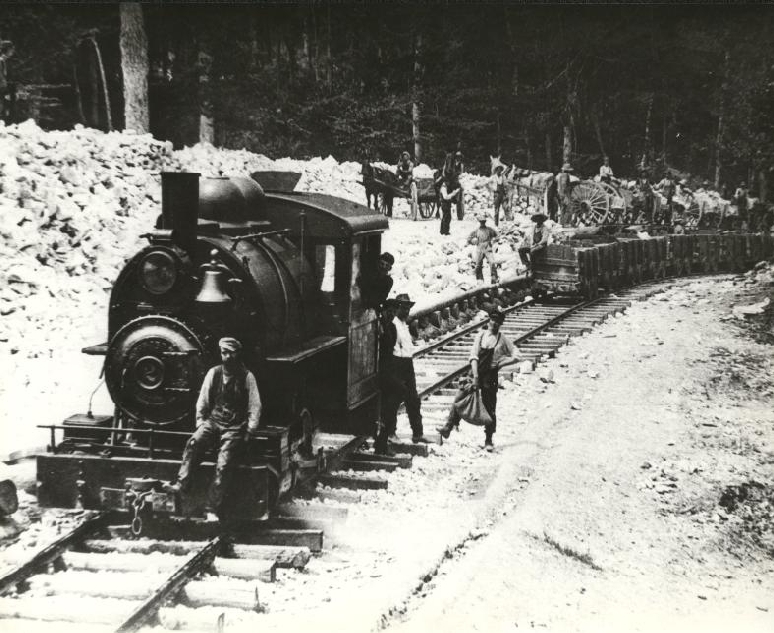   Gypsum being dumped from horse carts into ore cars.&nbsp;   1907  