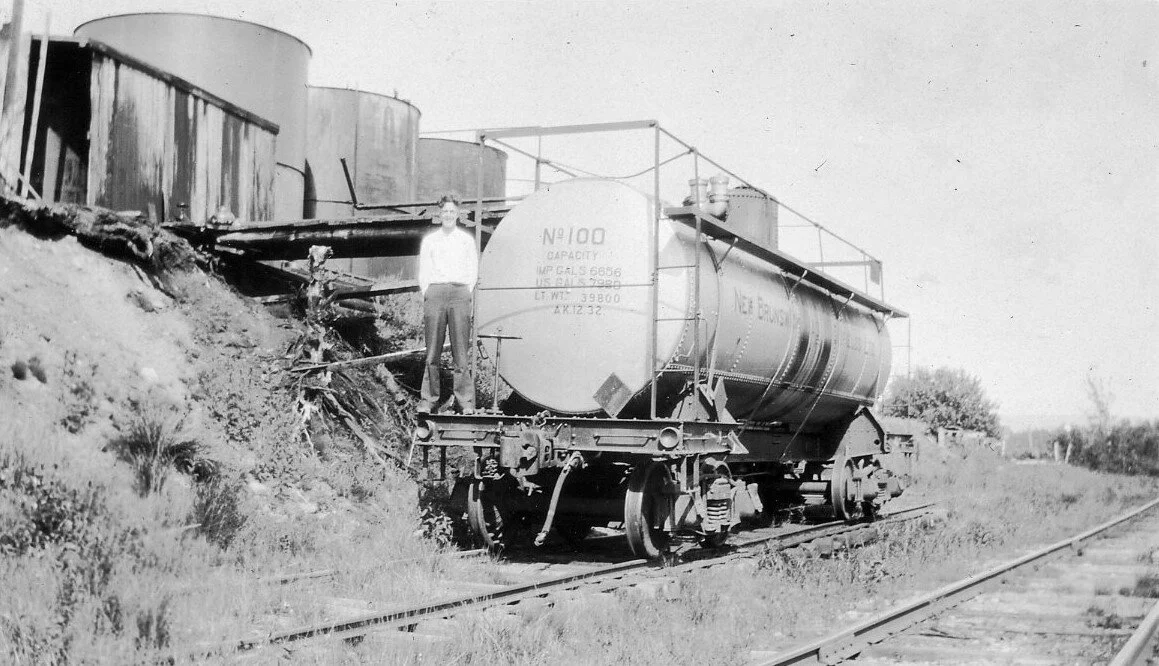 Stephen Steeves on rail Tanker 100 at siding in Weldon, July 5, 1933. From the Al Renton Collection