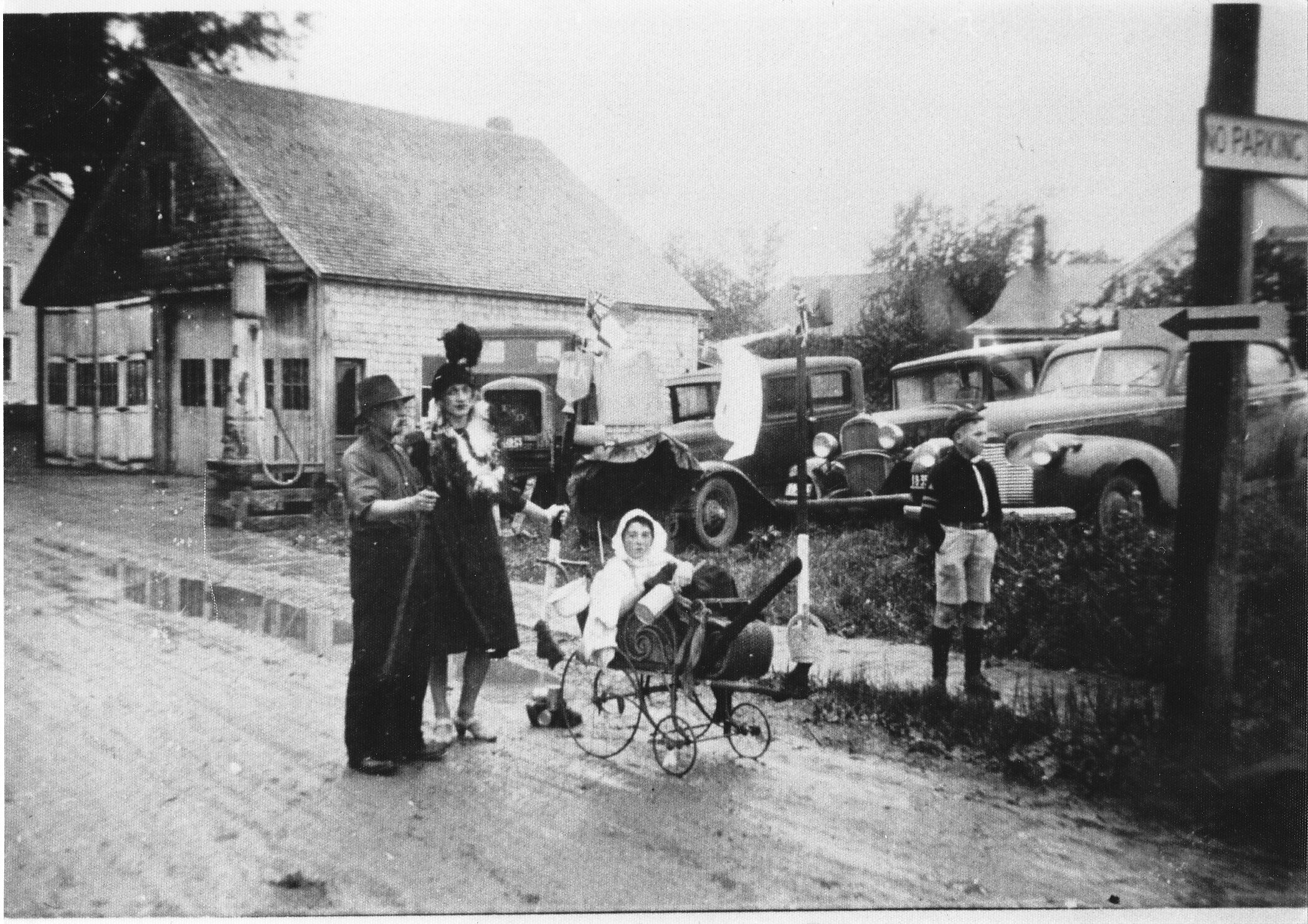 Getting ready for A parade in Hillsborough during the War in front of the N.B.Dept. of Transportation Garage on Academy Street. Later Snider’s Garage Which burned in 1981. Left to Right Walter Slater, Reg Duffy, Junior Jonah in Carriage, John Jones …