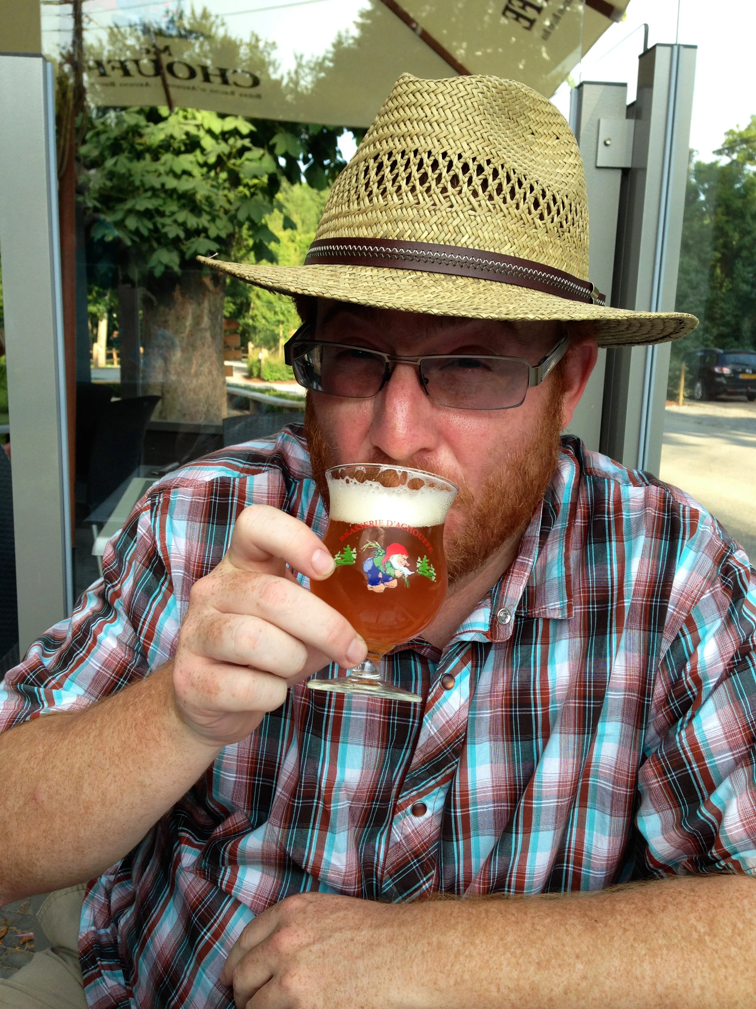 Enjoying a fresh Houblon Chouffe IPA at Taverne de la Brasserie D'achouffe in Belgium.