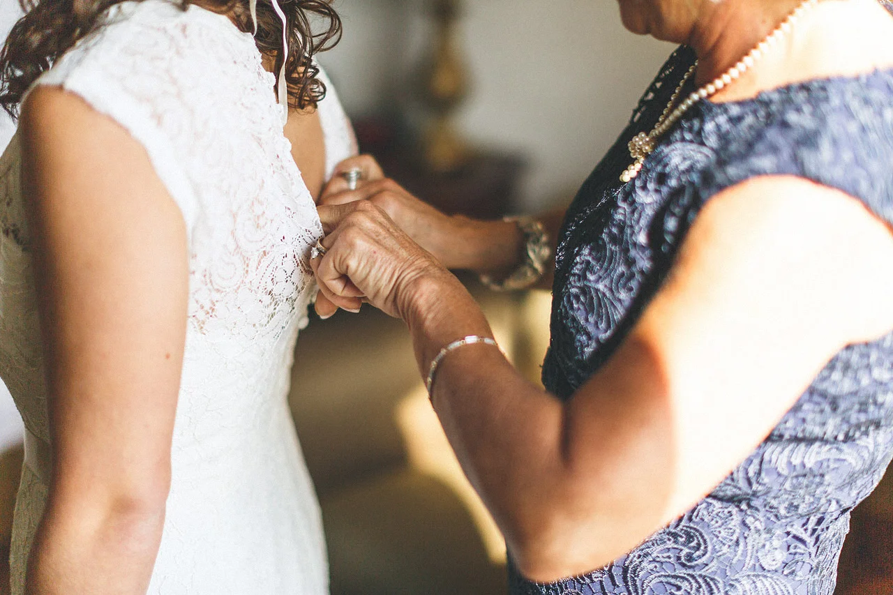Mom helping Daughter into Dress