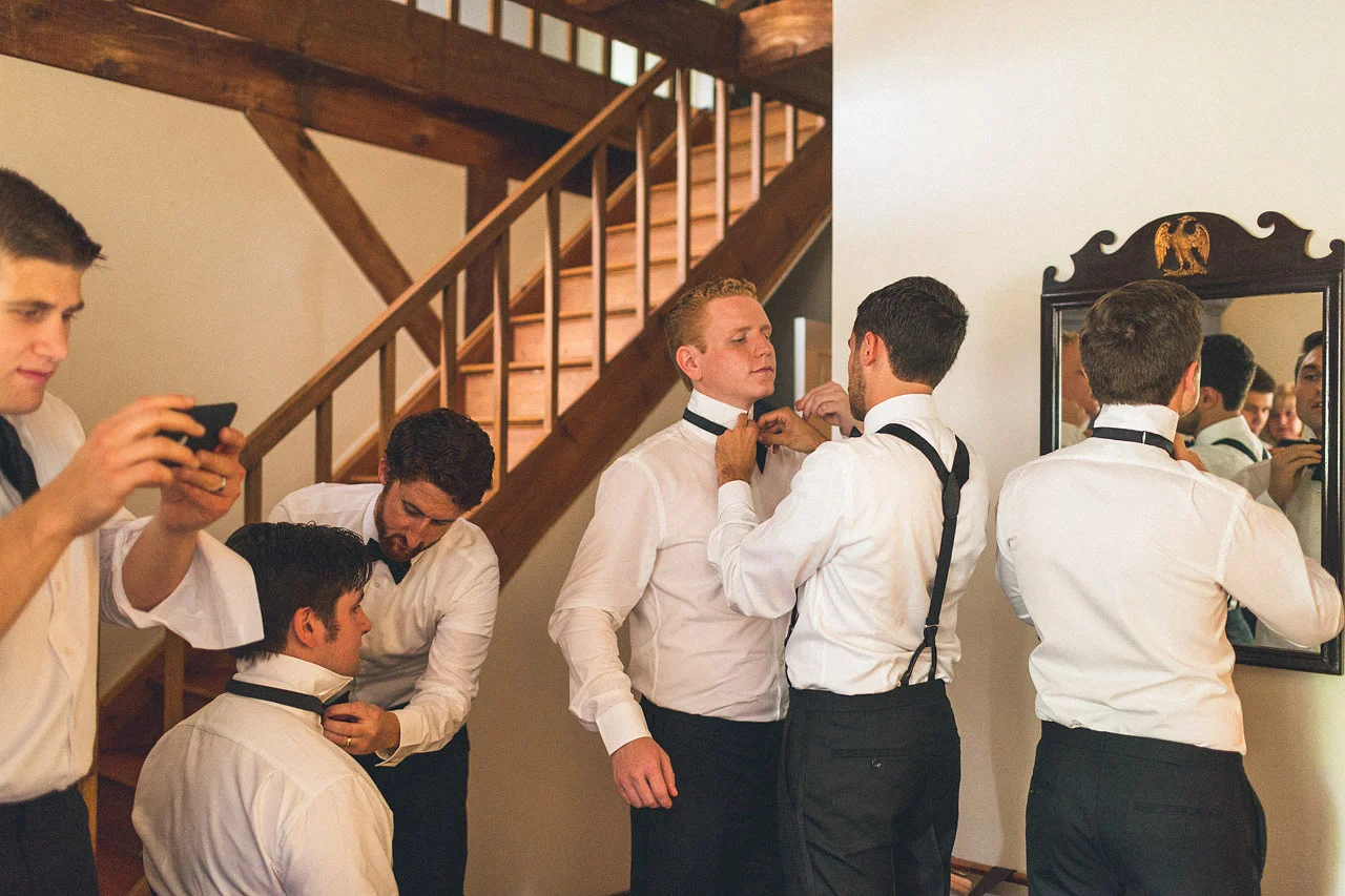 Groomsman work on bow ties