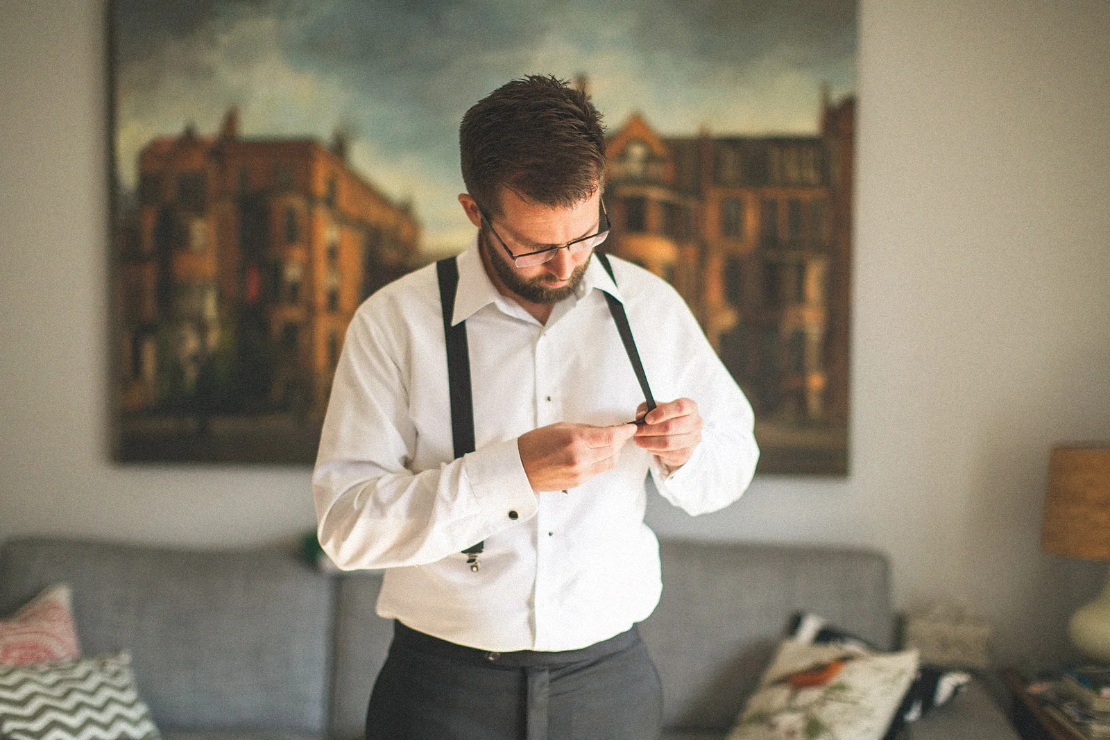 Groom adjust suspenders