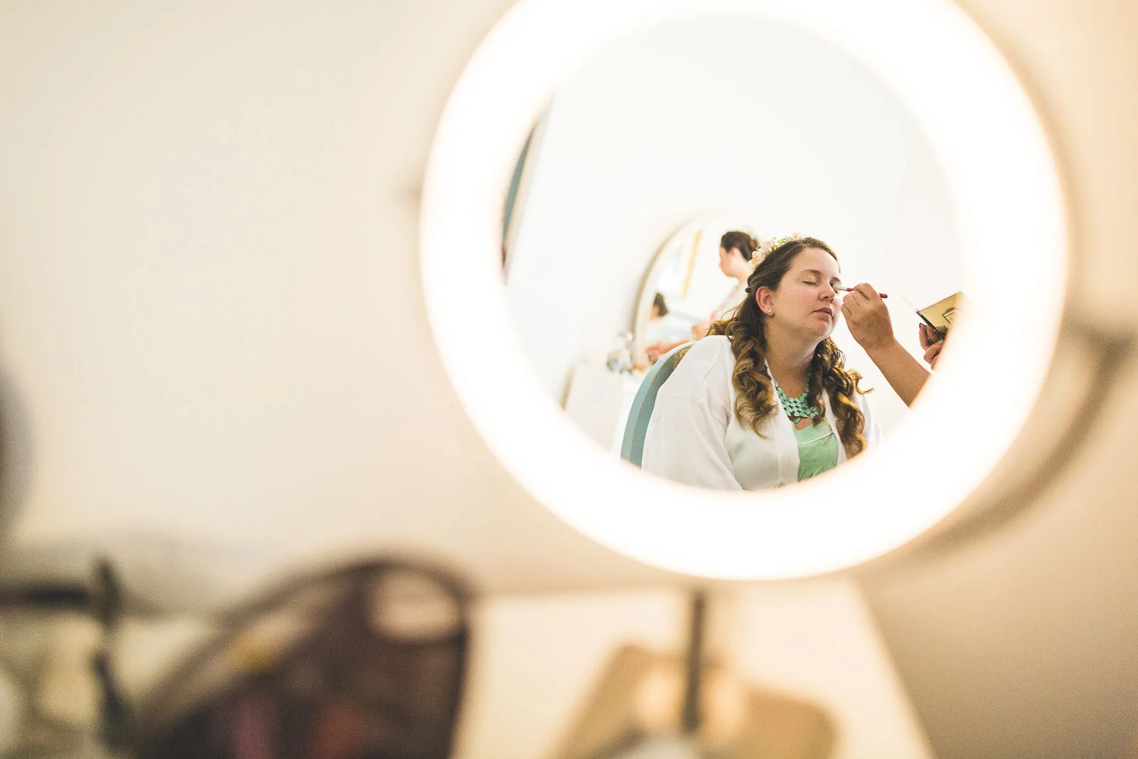 Bride getting makeup done