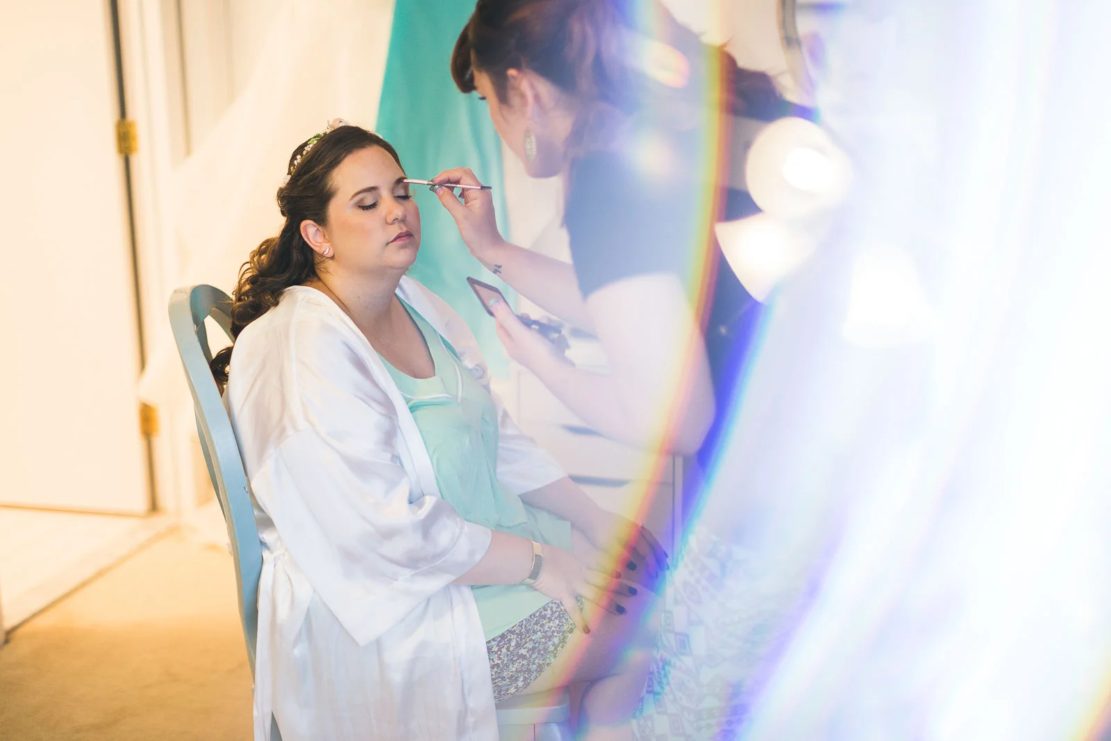 Bride getting makeup done