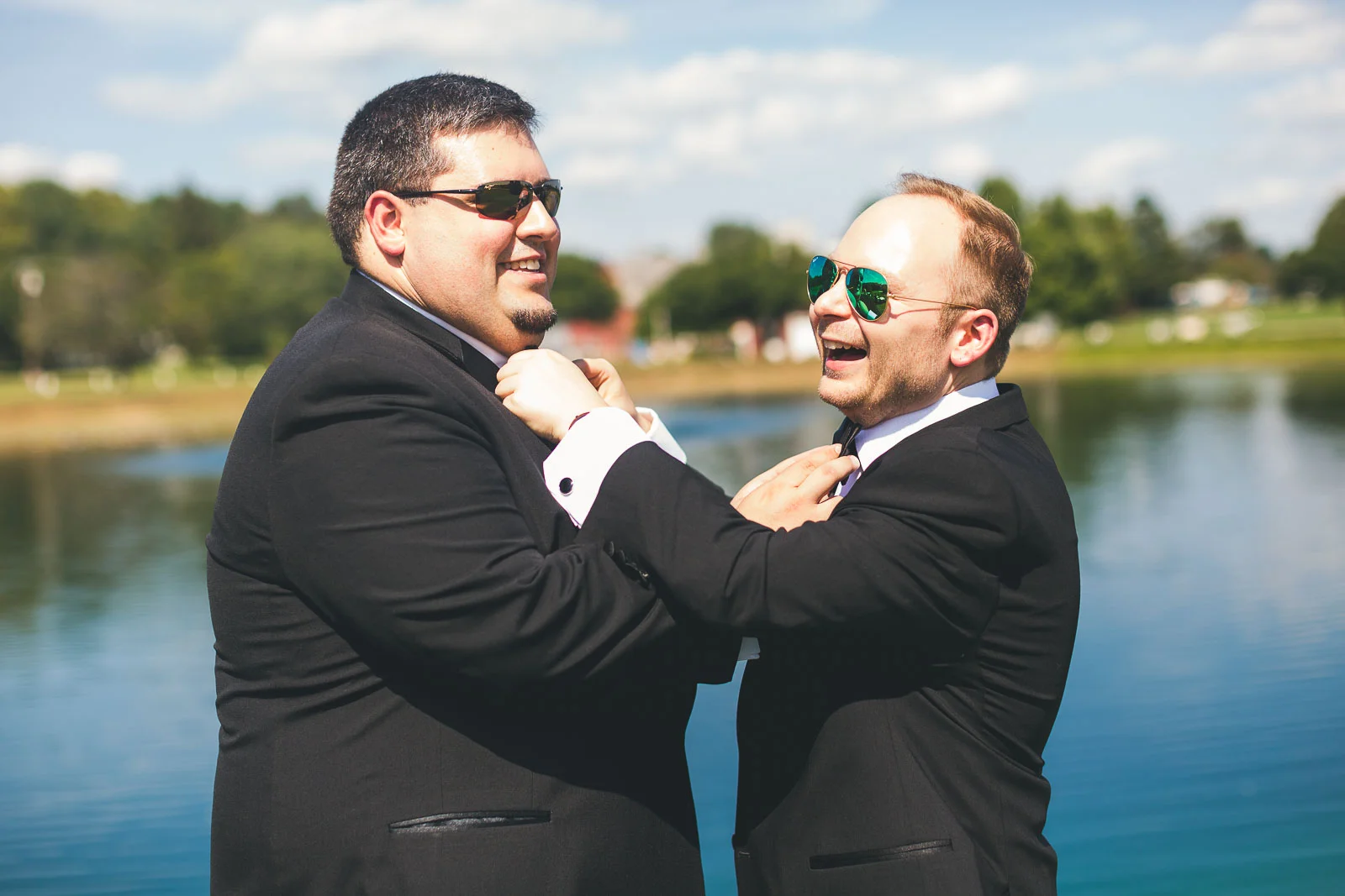 Groom adjusting tie