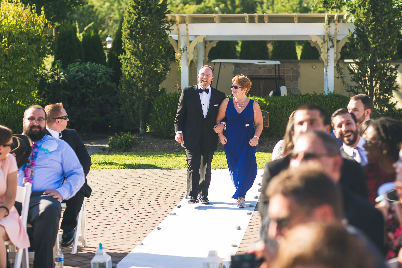 Groom walks down aisle with mom